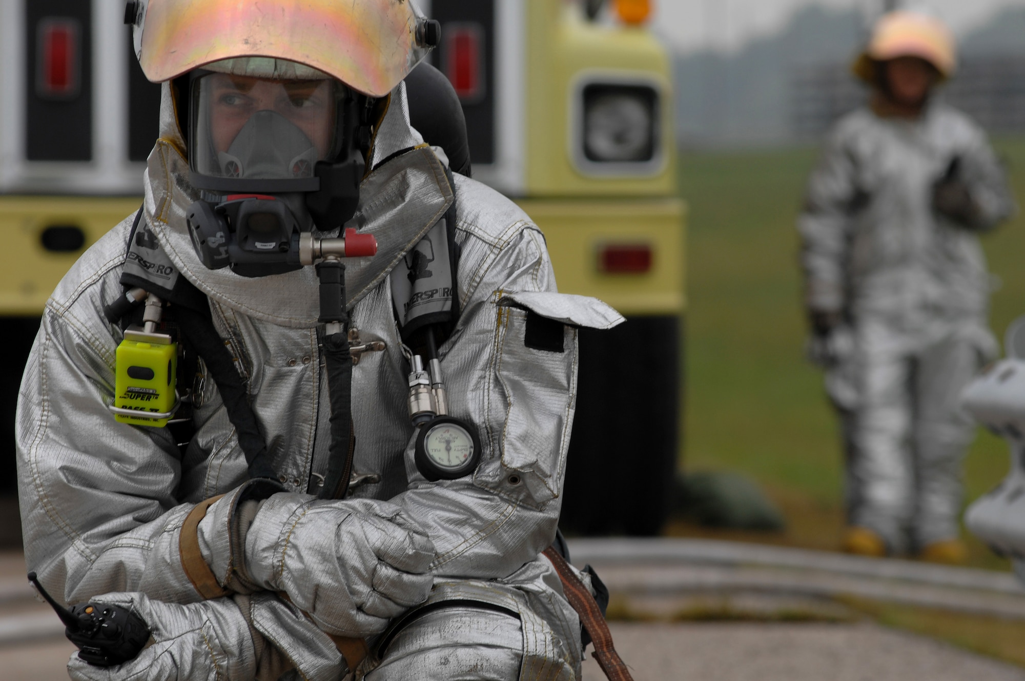 WHITEMAN AIR FORCE BASE, Mo. - Staff Sgt. Michael Zartner, 509th Civil Engineer Squadron firefighter, holds his position during a Mass Accident Response Exercise, Sept. 9. Airmen participating in the exercise were faced with a weapons transport that had come under enemy fire, resulting in injured casualties, a contamination spill and an ignited B-61 missile.  Firefighters, security forces, medical, explosive ordinance and munitions personnel all played major roles in the exercise to successfully complete all tasks and meet training requirements. (U.S. Air Force photo/Senior Airman Kenny Holston) 