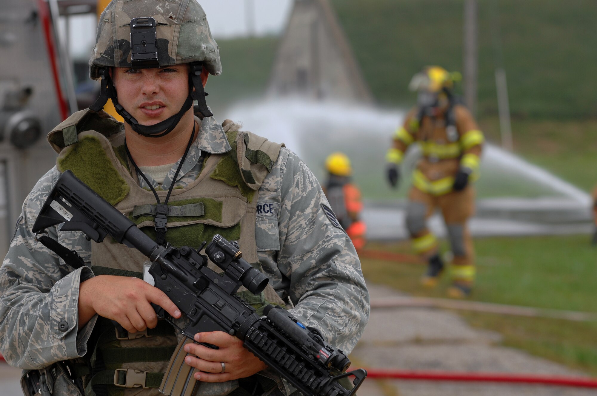 WHITEMAN AIR FORCE BASE, Mo. - Staff Sgt. Travis Daniels, 509th Security Forces Squadron, guards the entry control point of a contaminated area during a Mass Accident Response Exercise, Sept. 9. Airmen participating in the exercise were faced with a weapons transport that had come under enemy fire, resulting in injured casualties, a contamination spill and an ignited B-61 missile.  Firefighters, security forces, medical, explosive ordinance and munitions personnel all played major roles in the exercise to successfully complete all tasks and meet training requirements. (U.S. Air Force photo/Senior Airman Kenny Holston) 