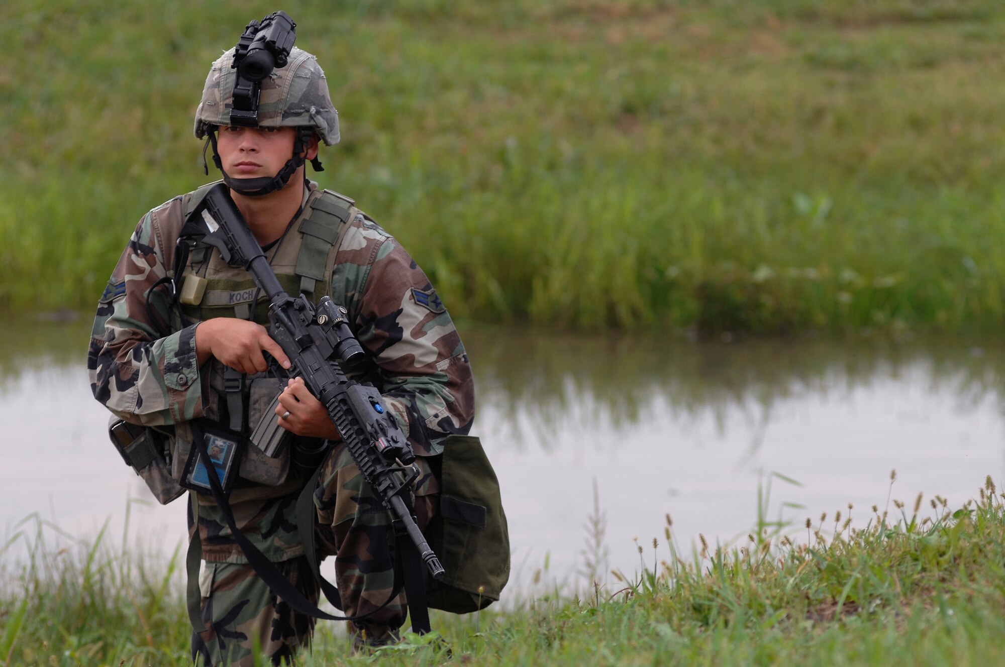 WHITEMAN AIR FORCE BASE, Mo. - Airman 1st Class Corey Koch, 509th Security Forces Squadron, guards the perimeter of a contaminated area during a Mass Accident Response Exercise, Sept. 9. Airmen participating in the exercise were faced with a weapons transport that had come under enemy fire, resulting in injured casualties, a contamination spill and an ignited B-61 missile.  Firefighters, security forces, medical, explosive ordinance and munitions personnel all played major roles in the exercise to successfully complete all tasks and meet training requirements. (U.S. Air Force photo/Senior Airman Kenny Holston) 