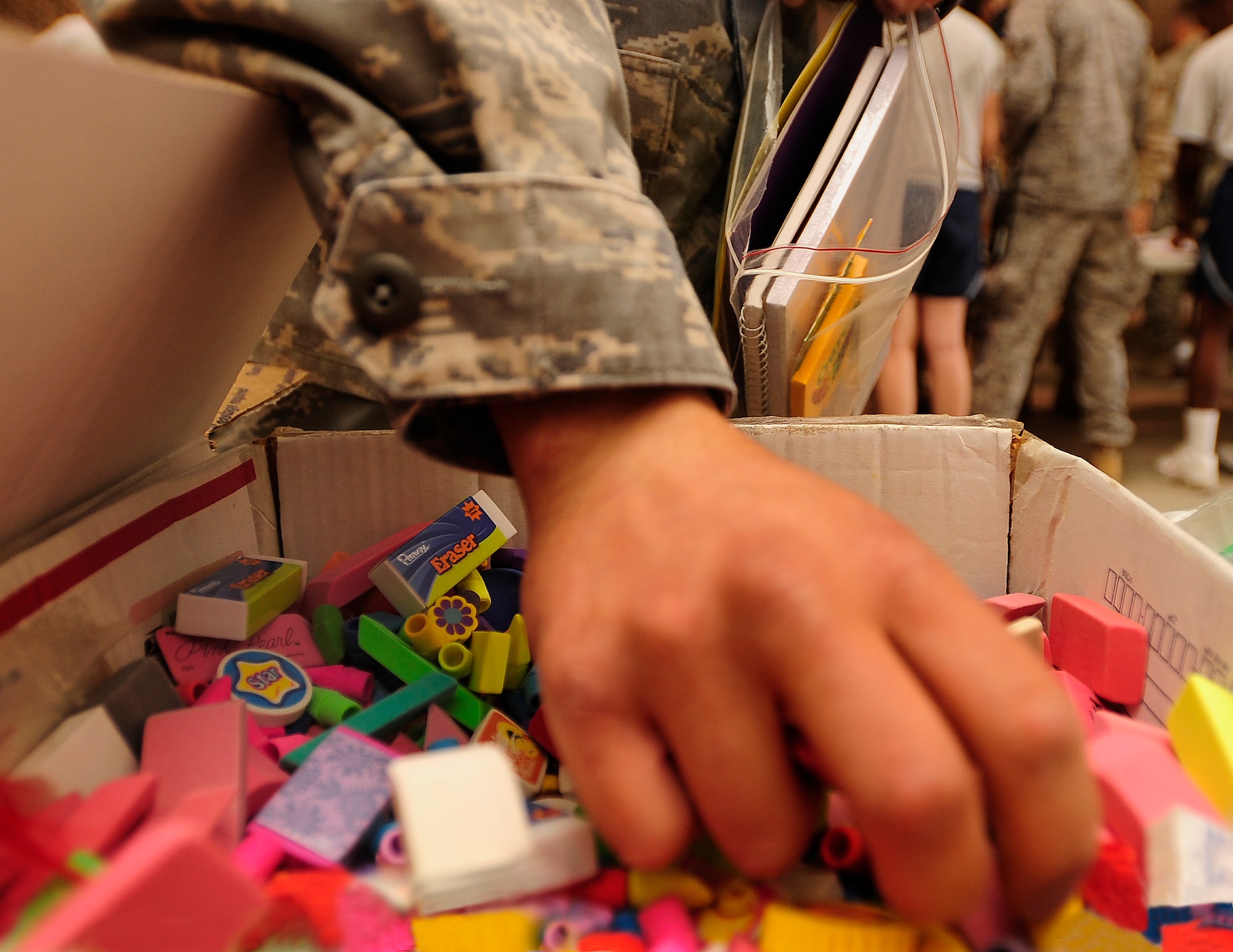 ALI BASE, Iraq - Airmen from the 407th Air Expeditionary Group assembled school supplies and toys for Operation Iraqi Child Sept. 5, 2009.  The school supplies will be distributed to local communities in southern Iraq to prepare children for the upcoming school year. (Photo by / Airman 1st Class Tony R. Ritter)