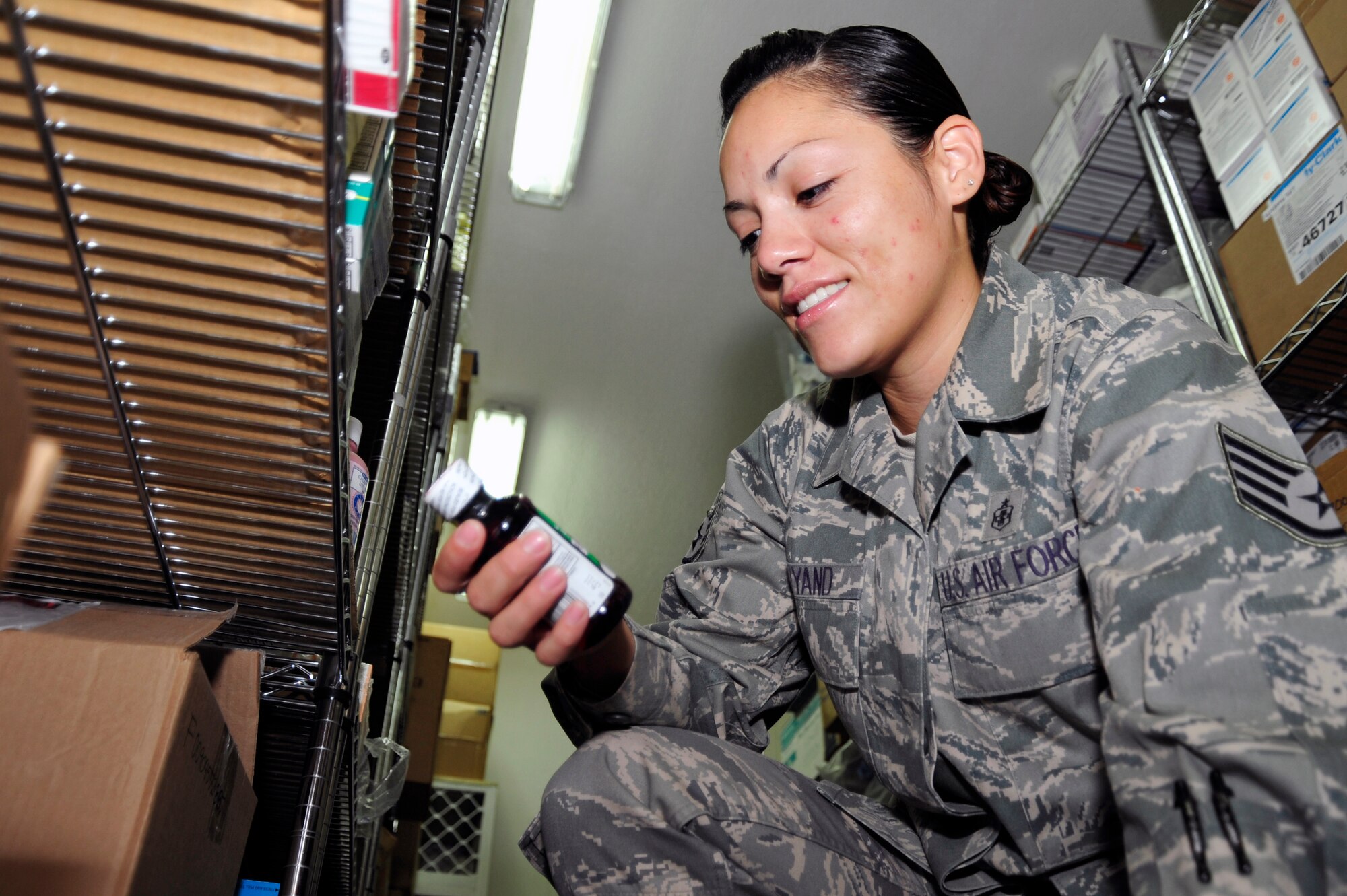 SOUTHWEST ASIA -Staff Sgt. Evelina Wyand, 380th Expeditionary Medical Group, checks the expiration date on medical supply items Sept. 8, 2009. Sergeant Wyand is the medical materials non-commisioned officer in charge while deployed from Andrews Air Force Base, Md., and grew up in Chicago, Ill. (U.S. Air Force photo/Tech. Sgt. Charles Larkin Sr)