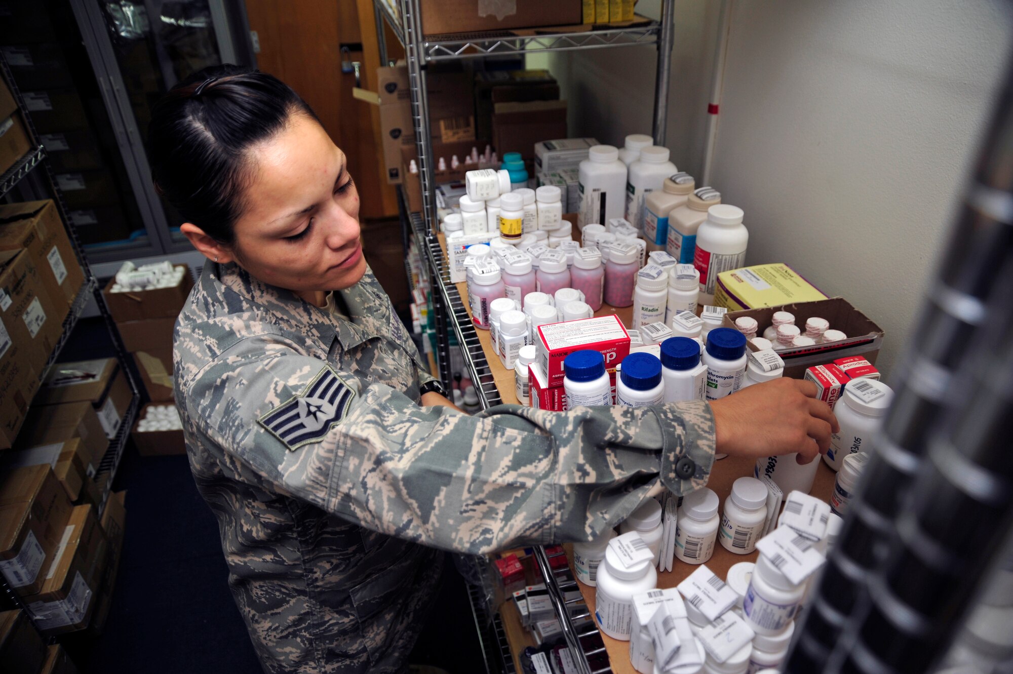 SOUTHWEST ASIA -Staff Sgt. Evelina Wyand, 380th Expeditionary Medical Group, checks the expiration date on medical supply items Sept. 8, 2009. Sergeant Wyand is the medical material non-commissioned officer in charge. She is deployed from Andrews Air Force Base, Md., and grew up in Chicago, Ill. (U.S. Air Force photo/Tech. Sgt. Charles Larkin Sr)