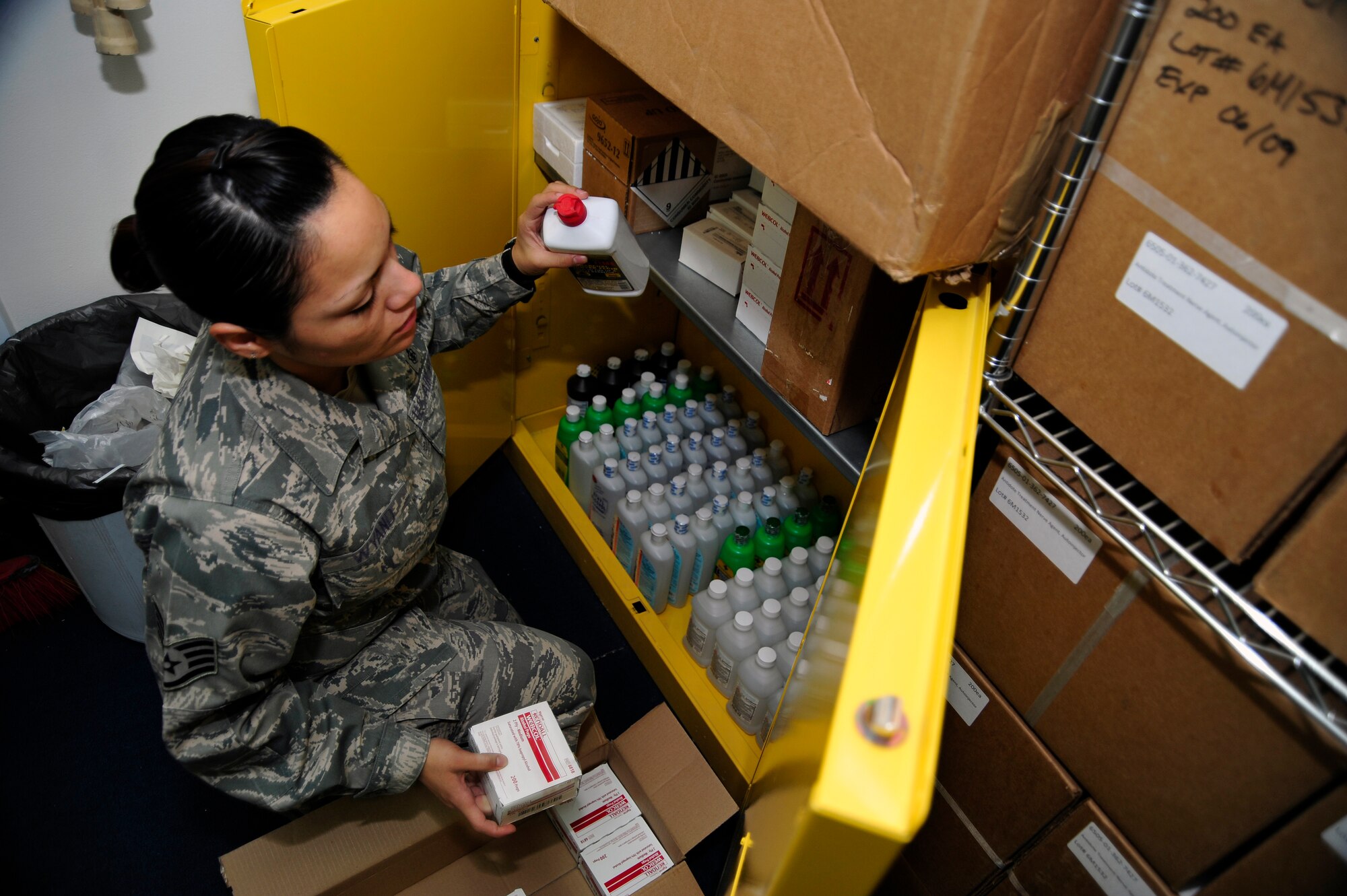 SOUTHWEST ASIA -Staff Sgt. Evelina Wyand, 380th Expeditionary Medical Group, stocks items in a supply cabinet Sept. 8, 2009. Sergeant Wyand is the medical materials non-commisioned officer in charge. She is deployed from Andrews Air Force Base, Md., and grew up in Chicago, Ill. (U.S. Air Force photo/Tech. Sgt. Charles Larkin Sr)