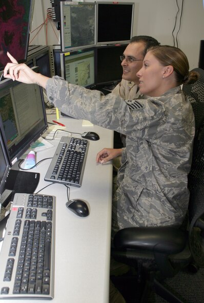 SHAW AIR FORCE BASE, S.C. -- Tech. Sgt. Casey Grim, a reservist with the 5th Operational Weather Flight, and Navy Petty Officer 2nd Class Jorge Castillo, an aerographer’s mate second class from Naval Station Norfolk, Va., both serve together at the 28th Operational Weather Squadron here as Joint Operational Area Forecasters. The combined 28th OWS team provides weather products for all branches of the U.S. military and our coalition partners in the U.S. Central Command's AOR, covering 20 countries spanning 5,000 square miles on two continents. (Photo by Ryan Hansen)