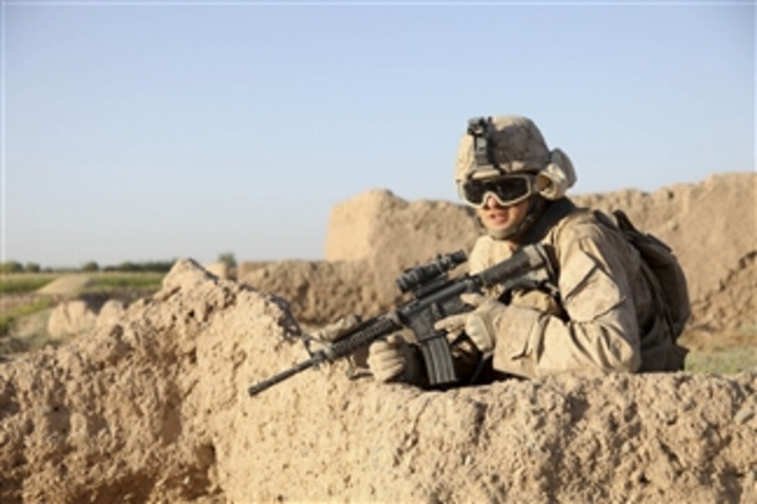A U.S. Marine with Guard Force 1, 1st Battalion, 5th Marine Regiment provides security during a road reconnaissance patrol in the Nawa district of the Helmand province, Afghanistan, on Sept. 6, 2009.  The Marines are conducting the patrol to secure a reliable, safe passage between the government center in Nawa and Forward Operating Base Geronimo in Nawa.  The 1st Battalion, 5th Marine Regiment is deployed with Regimental Combat Team 3 to conduct counterinsurgency operations in partnership with Afghan National Security Forces in southern Afghanistan.  