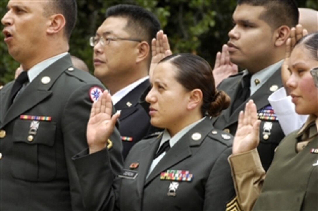 Thirty-one U.S. military members took the oath of allegiance before friends and family during a U.S. military naturalization ceremony in the Pentagon courtyard, Sept. 10, 2009. 
