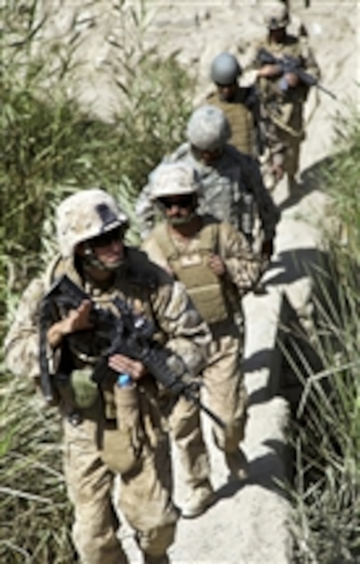 Commander of the 1st Battalion, 5th Marine Regiment Lt. Col. William McCollough, U.S. Marine Corps, crosses a bridge in the Nawa district of the Helmand province, Afghanistan, on Sept. 6, 2009.  The 1st Battalion, 5th Marine Regiment is deployed with Regimental Combat Team 3 to conduct counterinsurgency operations in partnership with Afghan National Security Forces in southern Afghanistan.  