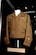 DAYTON, Ohio -- Eisenhower jacket worn by Tech. Sgt. Ray McKinley while a member of the Maj. Glenn Miller Army Air Force Band, including the period he was its leader following Maj. Miller's disappearance. The jacket, donated by Ray McKinley of Stamford, Conn., is on display in the World War II Gallery at the National Museum of the U.S. Air Force. (U.S. Air Force photo)