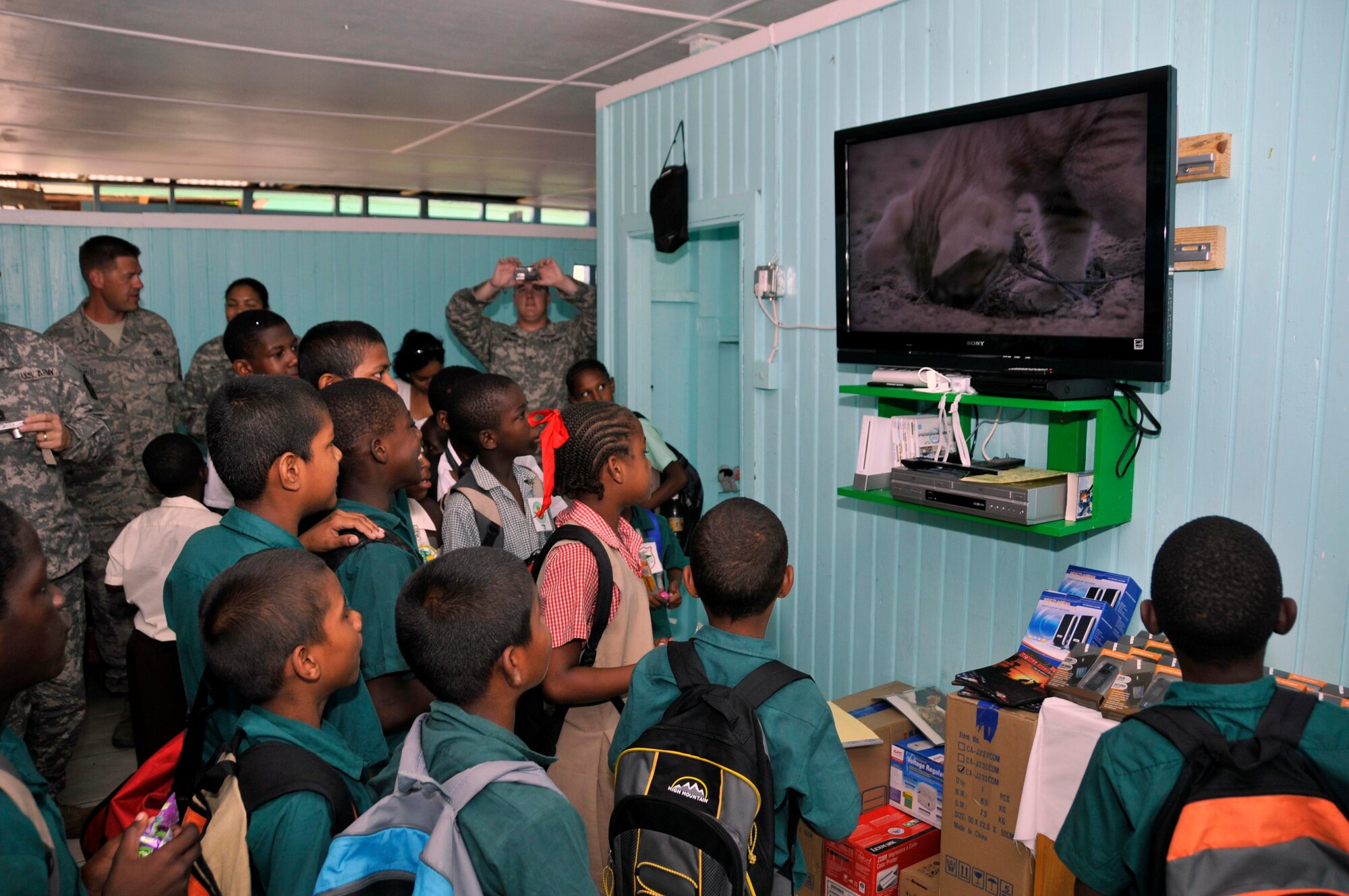 Children from the Joshua's Place Orphanage, watch a movie on their brand new 40 inch TV Sept. 9, 2009. Soldiers from the Georgia Army National used donation money collected back home, to buy a 40 inch LCD TV, a Nintendo Wii with six video games, 20 MP3 players and a DVD/VCR player (U.S. Air Force photo by Airman 1st Class Perry Aston) (Released)