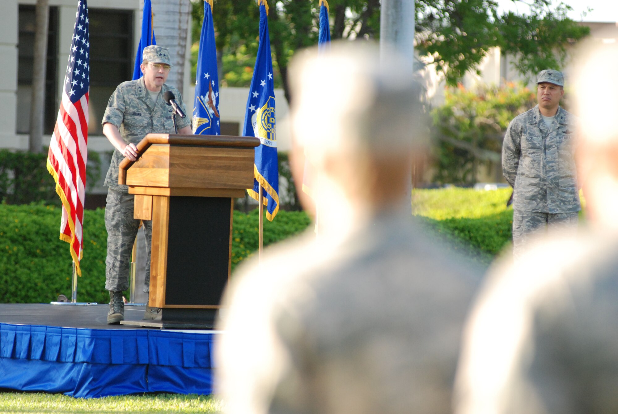 HICKAM AIR FORCE BASE, Hawaii -- Major Gen. Jan-Marc Jouas, Headquarters Pacific Air Forces director of operations, plans, requirements and programs, speaks during the Sept. 11 Remembrance Ceremony here. Instead of the monthly Warrior Run morale event, Hickam Airman paid tribute to those who lost their lives on 9/11 with a moment of silence in formation during the ceremony. A 15th Airlift Wing  C-17 fly-over further honored those on the 8th anniversary. (U.S. Air Force photo/Staff Sgt. Mike Meares)