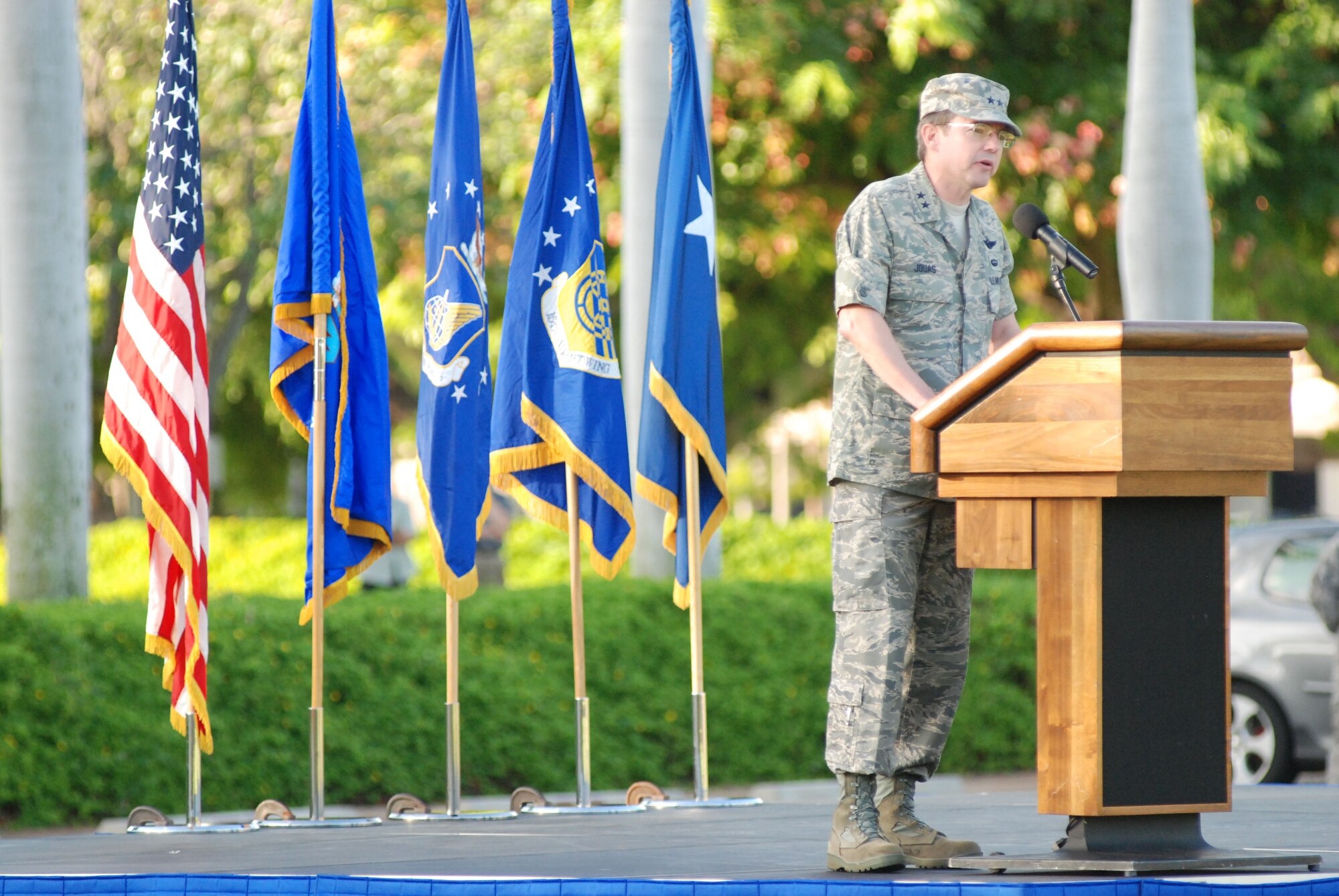 HICKAM AIR FORCE BASE, Hawaii -- Major Gen. Jan-Marc Jouas, Headquarters Pacific Air Forces director of operations, plans, requirements and programs, speaks during the Sept. 11 Remembrance Ceremony here. Instead of the monthly Warrior Run morale event, Hickam Airman paid tribute to those who lost their lives on 9/11 with a moment of silence in formation during the ceremony. A 15th Airlift Wing C-17 fly-over further honored those on the 8th anniversary. (U.S. Air Force photo/Staff Sgt. Mike Meares)