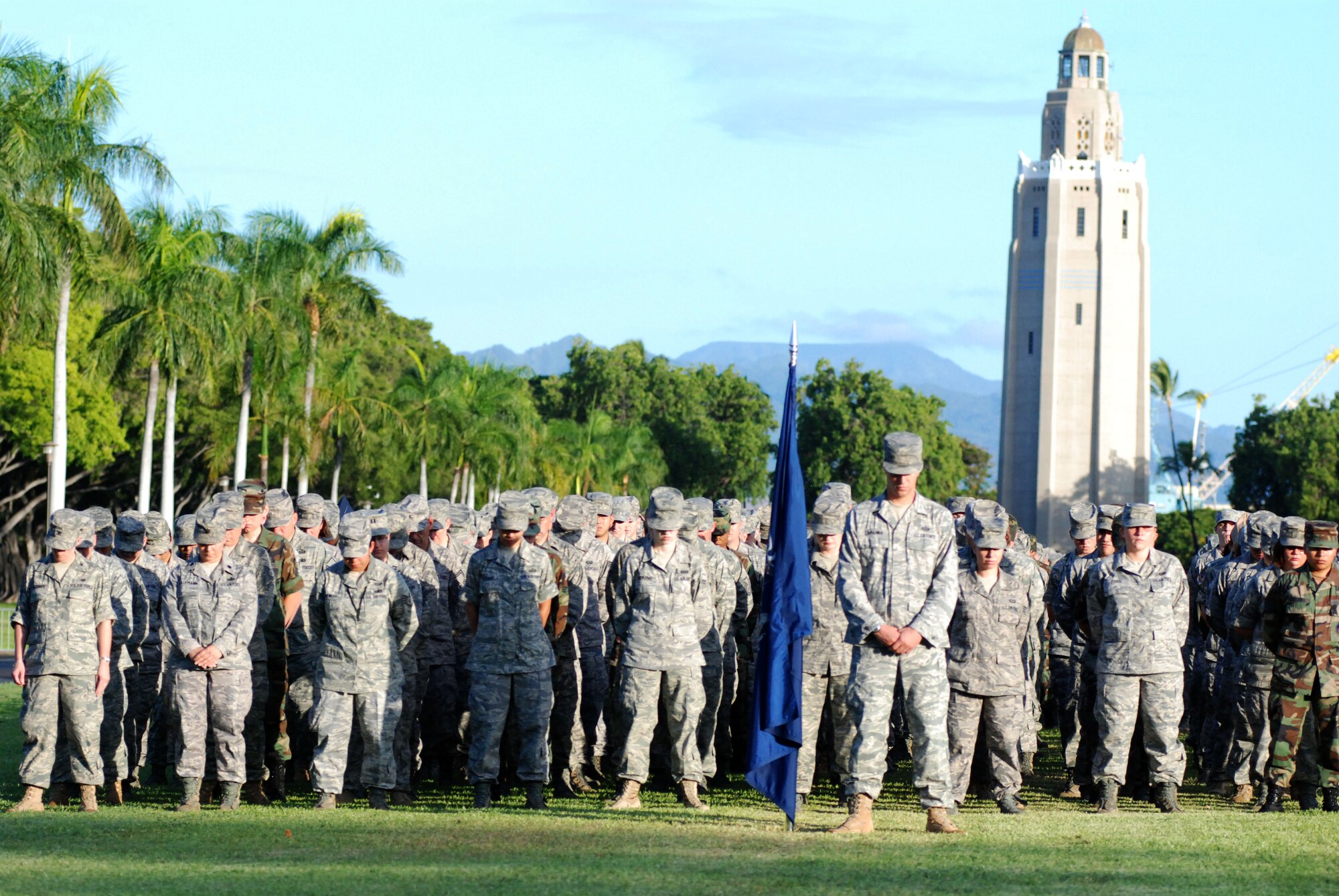 HICKAM AIR FORCE BASE, Hawaii -- Hickam Airman paid tribute to those who lost their lives on 9/11 with a moment of silence in formation during the Sept. 11 Remembrance Ceremony here. A 15th Airlift Wing C-17 fly-over further honored those on the 8th anniversary. (U.S. Air Force photo/Staff Sgt. Mike Meares)