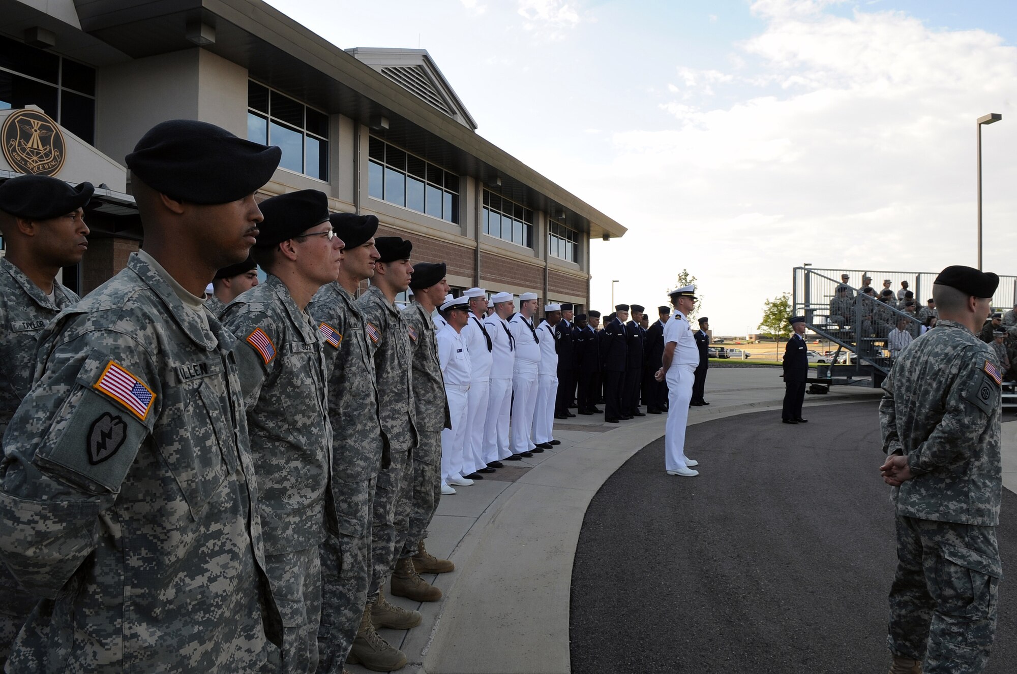 BUCKLEY AIR FORCE BASE, Colo. - Team Buckley members stand in formation during the Patriot Day ceremony Sept. 11. The United States flag was lowered to half-staff during Patriot Day in remembrance of the lives lost in 2001. (U.S. Air Force photo by Senior Airman John Easterling)