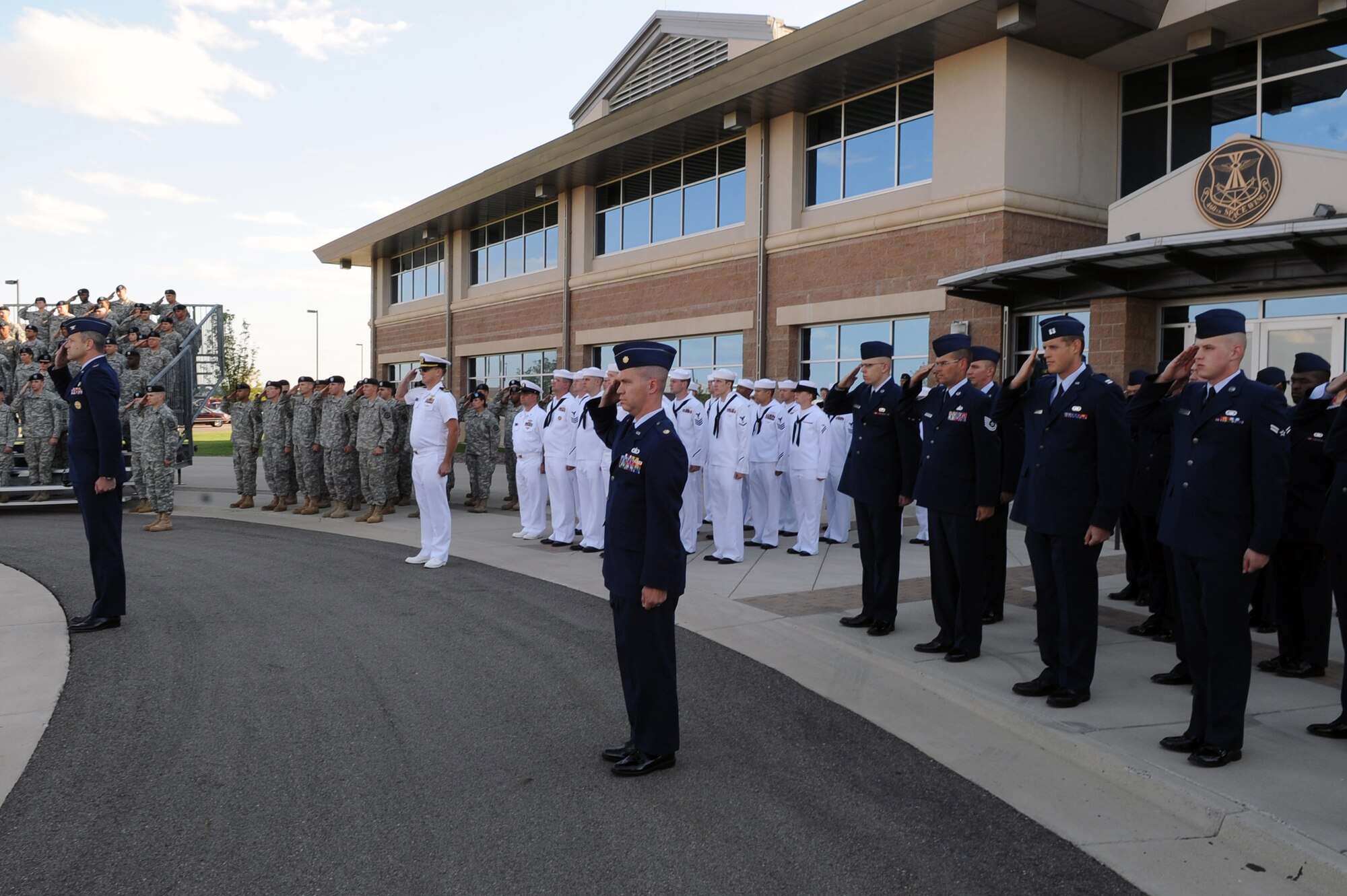 BUCKLEY AIR FORCE BASE, Colo. - Team Buckley members stand in formation during the Patriot Day ceremony Sept. 11. The United States flag was lowered to half-staff during Patriot Day in remembrance of the lives lost in 2001. (U.S. Air Force photo by Senior Airman John Easterling)