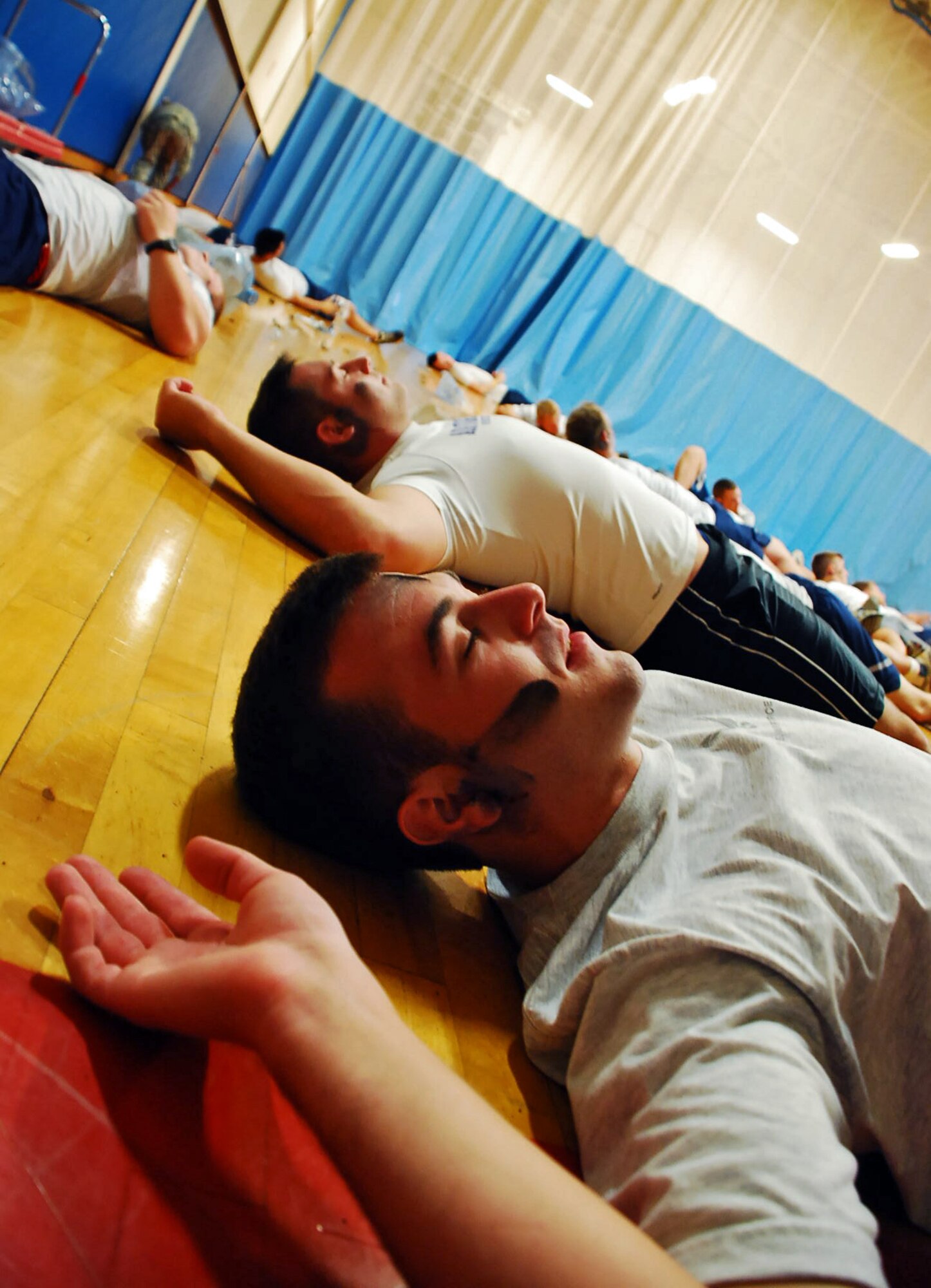 LAUGHLIN AIR FORCE BASE, Texas – Laughlin Airmen impersonate injured patients complete with fake wounds, after a mock explosion inside the old gym here Sept. 8. Members of the 47th Medical Group spent hours creating the fake wounds to provide additional training for emergency responders. The simulated explosion was a part of a base-wide exercise to test Laughlin’s ability to respond, communicate and make critical decisions during an intense situation. (U.S. Air Force photo by Senior Airman Sara Csurilla) 