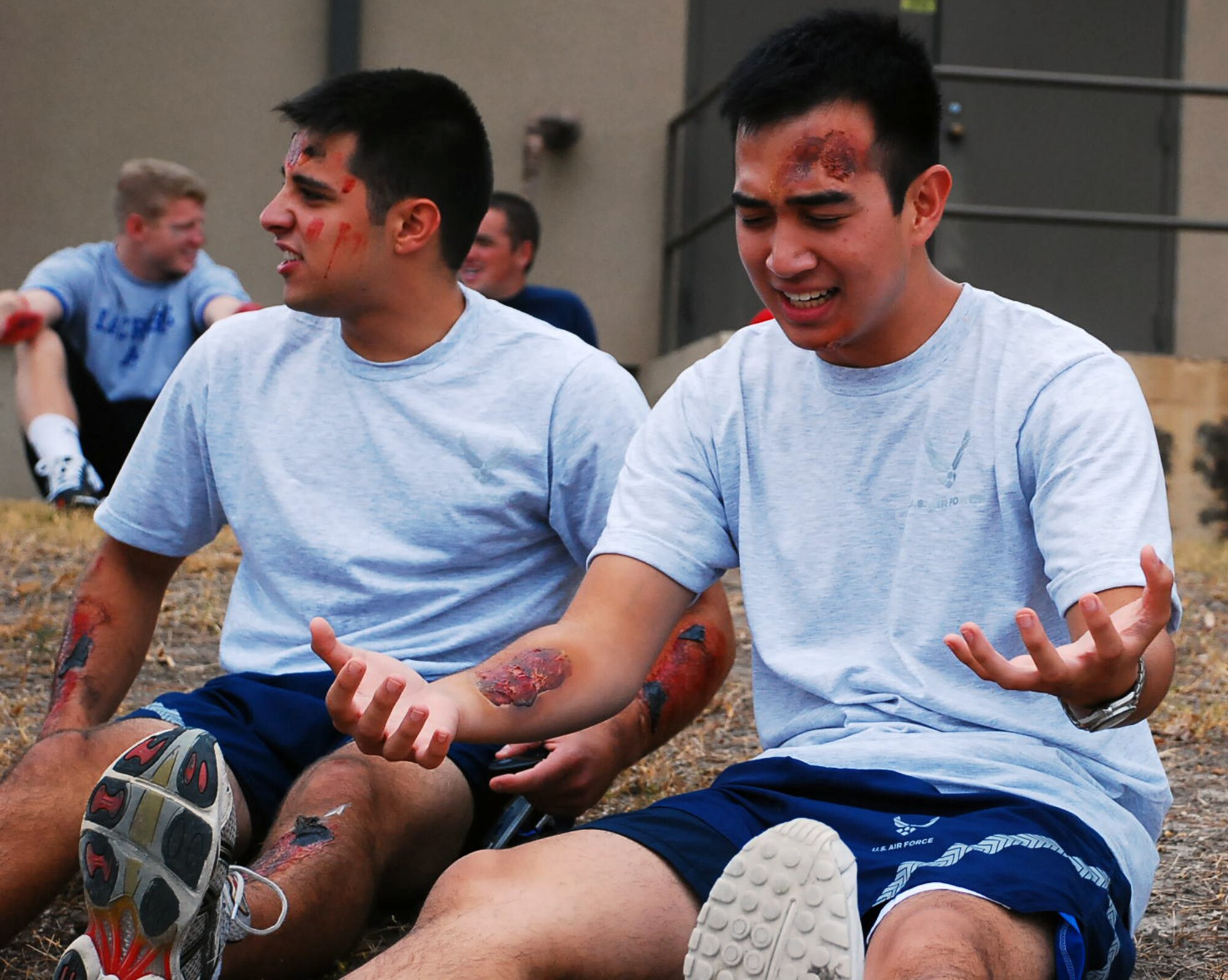 LAUGHLIN AIR FORCE BASE, Texas – Laughlin Airmen impersonate injured patients complete with fake wounds, after a mock explosion inside the old gym here Sept. 8. Members of the 47th Medical Group spent hours creating the fake wounds to provide additional training for emergency responders. The simulated explosion was a part of a base-wide exercise to test Laughlin’s ability to respond, communicate and make critical decisions during an intense situation. (U.S. Air Force photo by Senior Airman Sara Csurilla) 