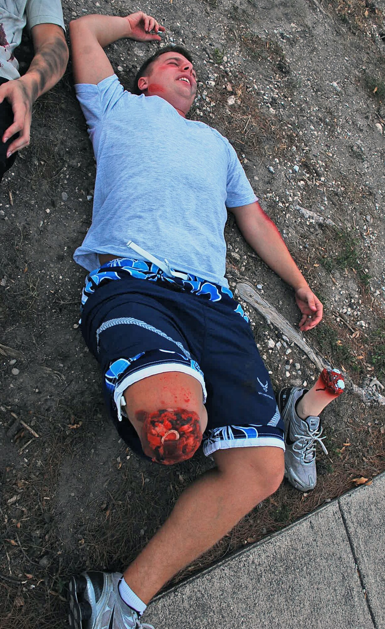 LAUGHLIN AIR FORCE BASE, Texas – Laughlin Airmen impersonate injured patients complete with fake wounds, after a mock explosion inside the old gym here Sept. 8. Members of the 47th Medical Group spent hours creating the fake wounds to provide additional training for emergency responders. The simulated explosion was a part of a base-wide exercise to test Laughlin’s ability to respond, communicate and make critical decisions during an intense situation. (U.S. Air Force photo by Senior Airman Sara Csurilla) 