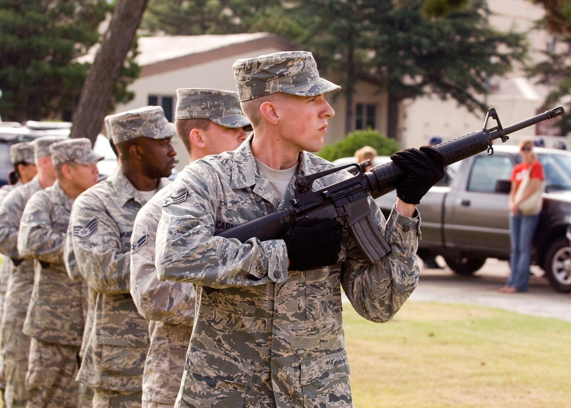 Members of the base honor guard fires a rifle volley during the September 11 Patriot Day Ceremony Sept. 11, 2009, at Kunsan Air Base, Republic of Korea. The ceremony acknowledged the courageous firefighters, police officers, emergency responders and others who risked their lives to save the victims of the tragic events of Sept. 11, 2001. The ceremony also paid tribute to the men and women of the U.S. Armed Forces who have served in the military, whether deployed or at home station, since these events. (U.S. Air Force photo/Senior Airman Jonathan Steffen) 