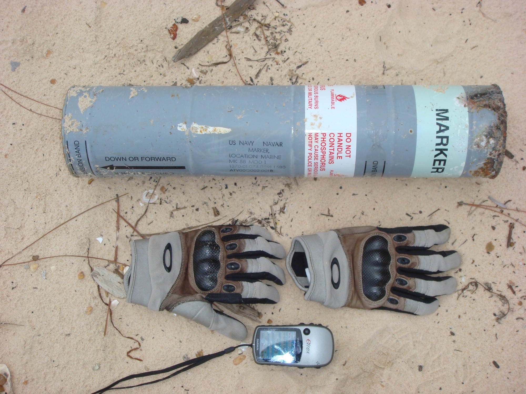 This is the 21-inch-long canister explosive ordnance disposal technicians from Hurlburt Field discovered and destroyed when they responded to an off-base call in Dauphin Island, Ala. The item is a marine marker, which is basically the water version of a road flare.  (Courtesy photo)                               
