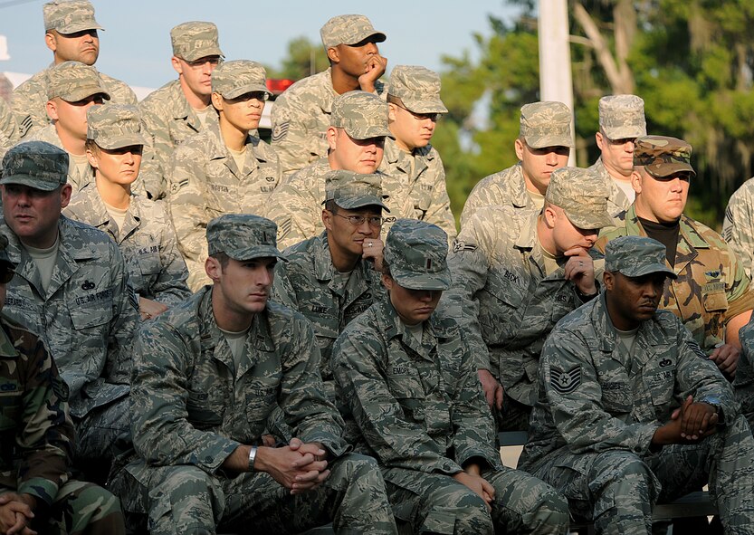 MOODY AIR FORCE BASE, Ga. -- Members from Moody listen to a recording of the initial dispatch from the New York fire department to the World Trade Center buildings on 9/11 during a ceremony here Sept. 11. (U.S. Air Force photo by Airman 1st Class Joshua Green) 