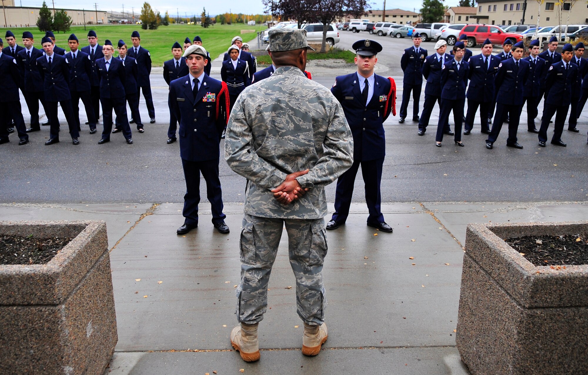 Col. Karlton Johnson addresses cadets of the Ben Eielson High School Air Force Junior Reserve Officers Training Corps after a flag ceremony in remembrance of the 9/11 attacks at the flag pole in front of Amber Hall Sept. 11, 2009, Eielson Air Force Base, Alaska. JROTC is a program designed to provide young men and women with an opportunity to learn and practice leadership skills. Colonel Johnson is the 354th Mission Support Group commander. (U.S. Air Force photo/Staff Sgt. Christopher Boitz)
