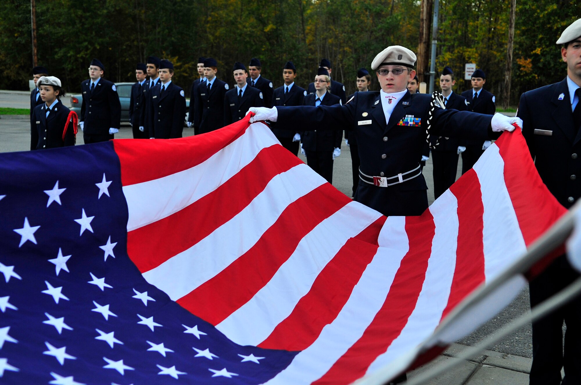 Cadet Tech. Sgt. Tyler Young, from Ben Eielson High School Air Force Junior Reserve Officers Training Corps, prepares to raise the flag during a ceremony in remembrance of the 9/11 attacks at the school flag pole Sept. 11, 2009, Eielson Air Force Base, Alaska. JROTC is a program designed to provide young men and women with an opportunity to learn and practice leadership skills. (U.S. Air Force photo/Staff Sgt. Christopher Boitz) 