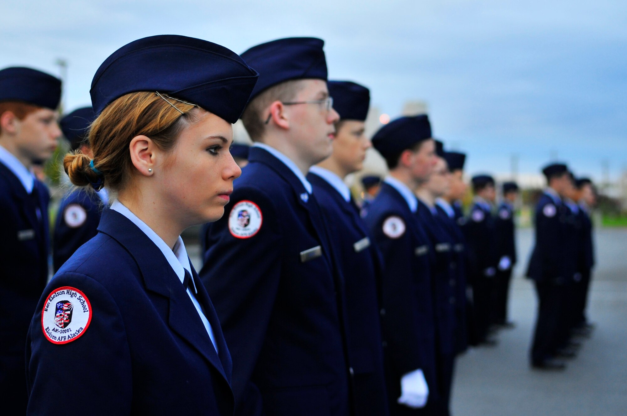 Cadet Airman 1st Class Stevie Wooley, from Ben Eielson High School Air Force Junior Reserve Officers Training Corps, stands in formation during a ceremony in remembrance of the 9/11 attacks at the school flag pole Sept. 11, 2009, Eielson Air Force Base, Alaska. JROTC is a program designed to provide young men and women with an opportunity to learn and practice leadership skills. (U.S. Air Force photo/Staff Sgt. Christopher Boitz) 