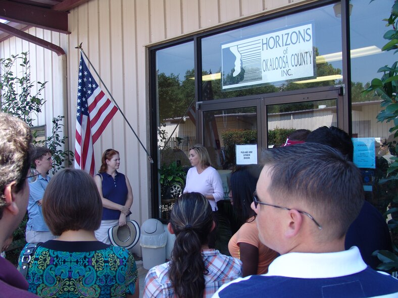 Missy Rogers, Horizons of Okaloosa County, explains the mission of HOC.  Key workers for the 2009 Combined Federal Campaign at Eglin toured local charities seeking assistance during the campaign. (U.S. Air Force photo by Leslie Brown)