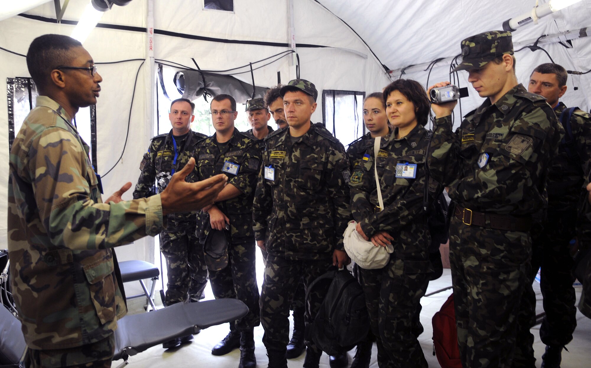 Lt. Col. Raymond Williams explains the squadron's dental care capabilities to multinational troops during an exercise orientation Sept. 8, 2009, in Nis, Serbia. Airment stood up the 458th Expeditionary Medical Squadron in support of the 2009 Military Medical Training Exercise in Central and Eastern Europe Sept. 2 through 13. Colonel Williams is assigned to the 458th Expeditionary Medical Squadron. (U.S. Air Force photo/Senior Airman Alex Martinez) 