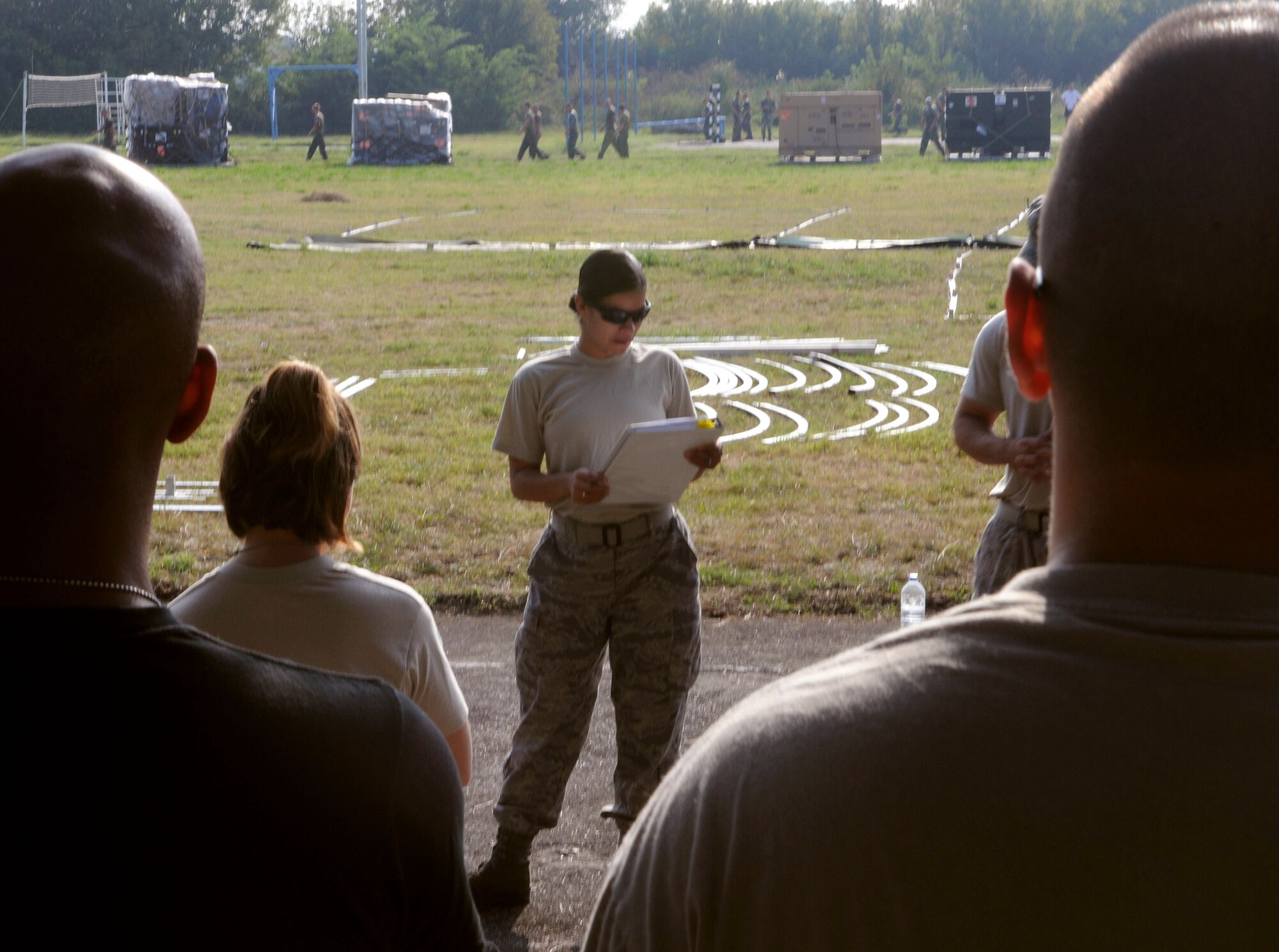 Staff Sgt. Melanie Hernandez briefs Airmen on the plan to set up tents for a mobile hospital Sept. 1, 2009, in Nis, Serbia. Fifteen nations participated in the exercise. Sergeant Hernandez is assigned to the 458th Expeditionary Medical Squadron. (U.S. Air Force photo/Senior Airman Alex Martinez) 
