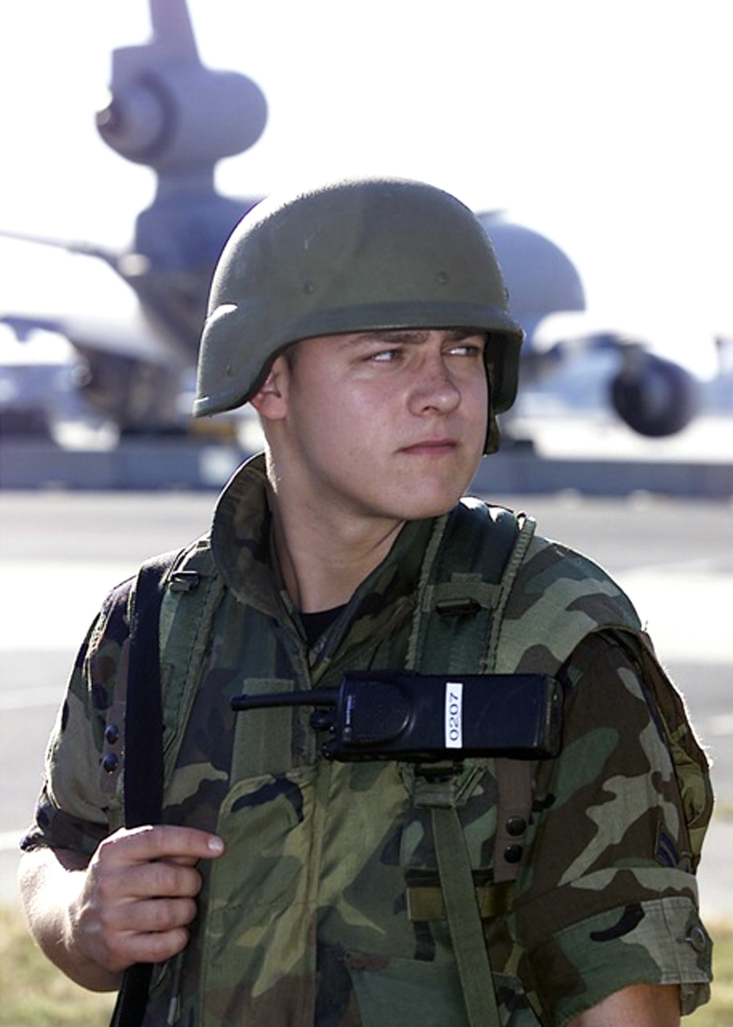 Airman First Class Thomas Messick of the 514th Security Forces Squadron, McGuire Air Force Base, N.J., guards the McGuire flightline on Sept. 11, 2001, in response to the terrorist attacks at the Pentagon, the World Trade Center of New York City and in Pennsylvania. In Air Mobility Command, the response to the attacks was immediate. At McGuire, now named Joint Base McGuire-Dix-Lakehurst, search and rescue teams and medical supplies were airlifted there by AMC aircraft and crews on Sept. 12. McGuire became the designated site by FEMA to house and feed urban search and rescue teams operating in New York City. (U.S. Air Force Photo/Ken Mann)