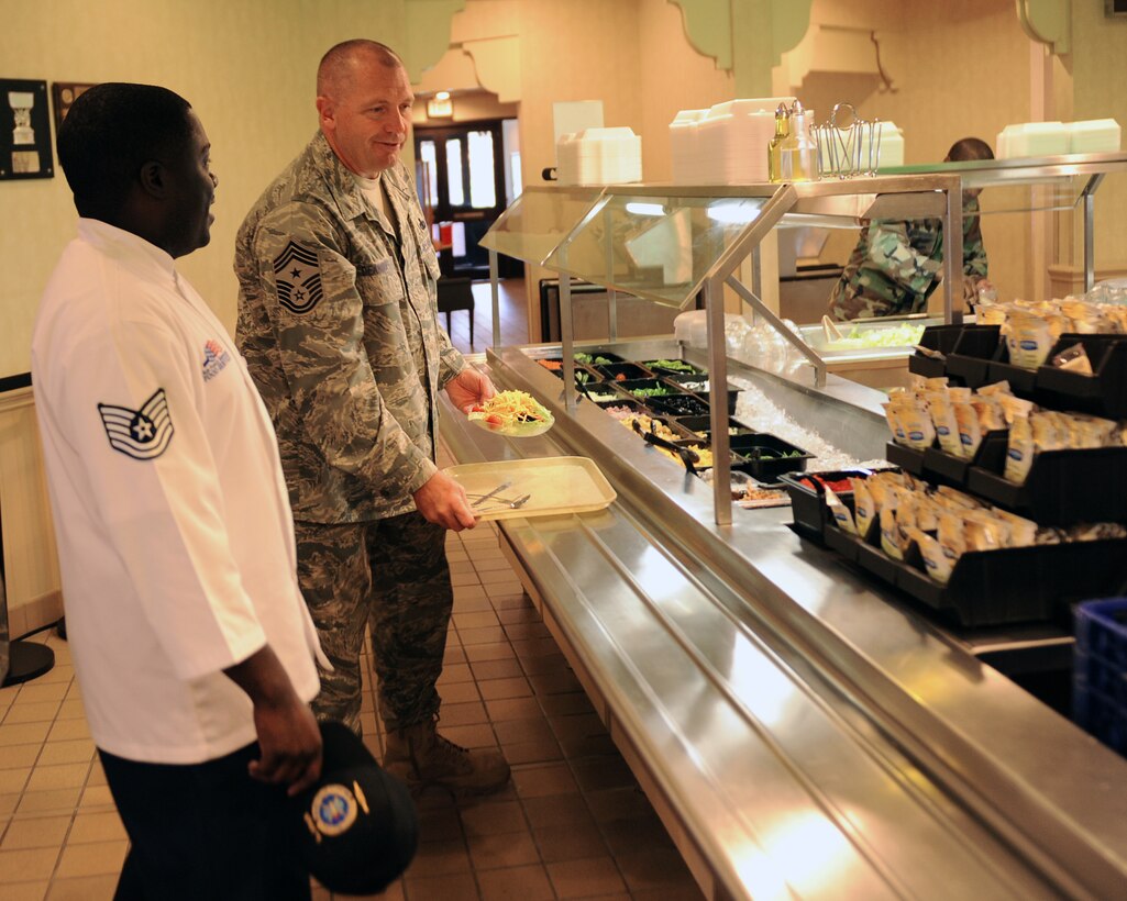 LANGLEY AIR FORCE BASE, Va. -- Chief Master Sgt. Scott Dearduff, command chief for the 9th Air Force and U.S. Air Forces Central Command, is given a tour by Tech. Sgt. Eric Brown, 1st Force Support Squadron assistant dining hall manager, of the Eagle Dining Hall here Sept. 11. Chief Dearduff visited with Airmen and toured some of Langley's squadrons after attending the Air Combat Command change-of-command Sept. 10. (U.S. Air Force photo/Airman1st Class Jonathan Koob)