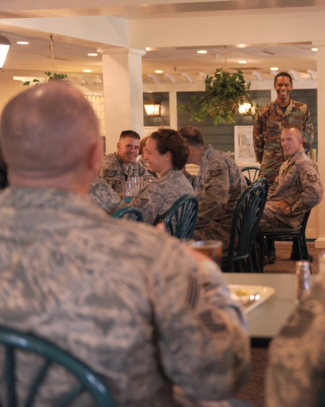 LANGLEY AIR FORCE BASE, Va. -- Staff Sgt. Marquis Echols, Aircraft Maintenance Squadron weapons section, answers a question Chief Master Sgt. Scott Dearduff, command chief for the 9th Air Force and U.S. Air Forces Central Command, asked him during a luncheon held for Chief Dearduff to get to know the Airmen better here Sept.11. Chief Dearduff visited with Airmen and toured some of Langley's squadrons after attending the Air Combat Command change-of-command Sept. 10. (U.S. Air Force photo/Airman1st Class Jonathan Koob)