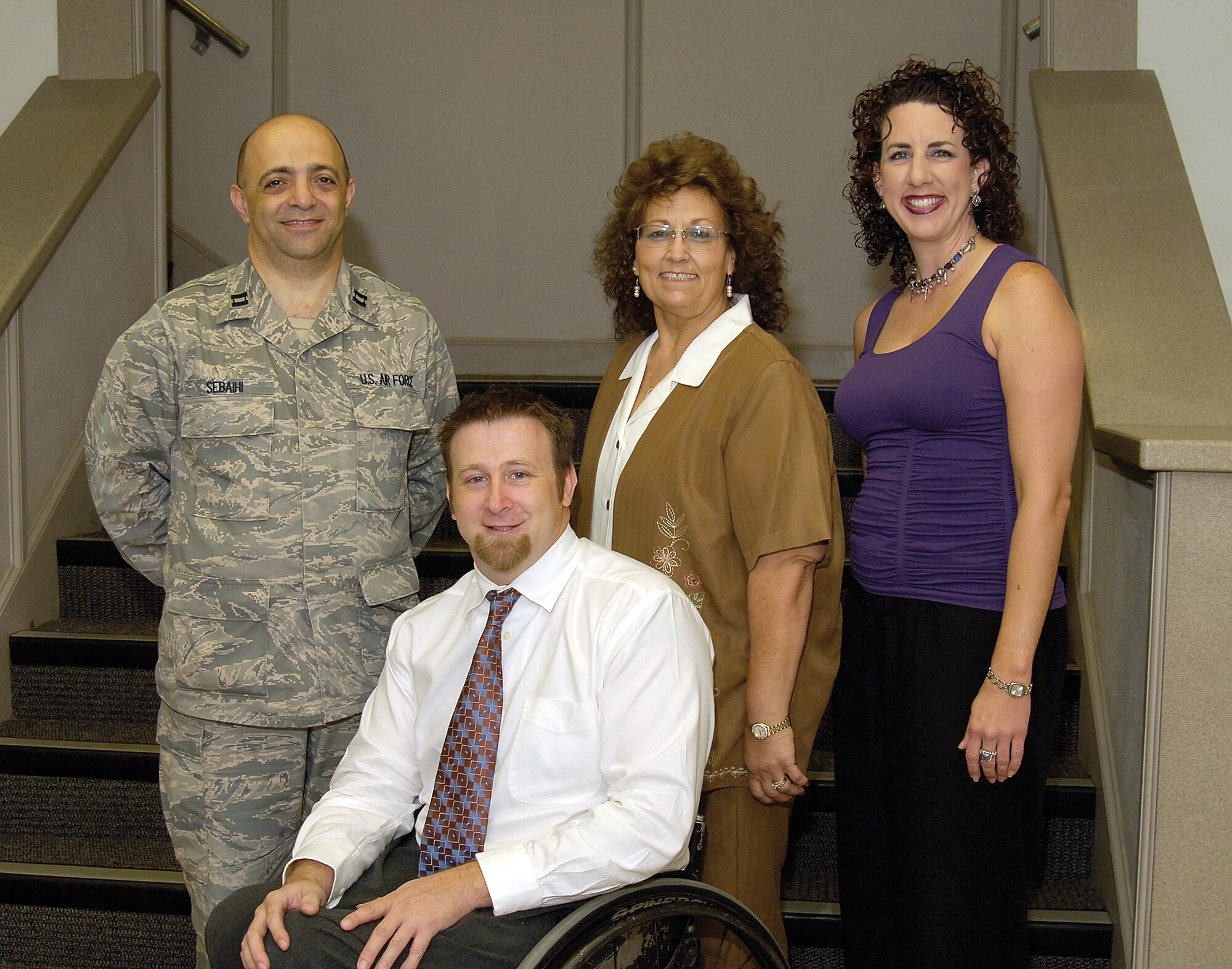 From left: Combined Federal Campaign loaned executives Capt. Sam Sebaihi, Tim Eldridge and Melda Smith, along with Department of Defense central Oklahoma region CFC director Mindy Banz, prepare for the annual DOD campaign that runs Oct. 7-Nov. 13.  The four Tinker employees volunteer for their roles as liaisons between the United Way and federal defense organizations with approximately 23,000 people, said Ms. Banz. “They’re the glue that holds everything together,” she said. (Air Force photo by Margo Wright)
