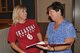 Amy Gonzalez, right, a DSCR change management specialist, talks with Amelia George, a DLA Oklahoma City supply technician, during an Inventory Management System Positioning class at Tinker Aug. 13. (DLA photo by Debra R.Bingham)