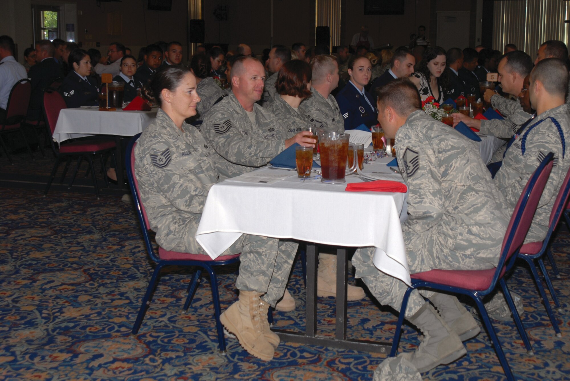 Inductees and guests chat while they wait their turn for the lunch buffet at the ceremony, (U.S. Air Force photo by Staff Sgt. Laura R. McFarlane))