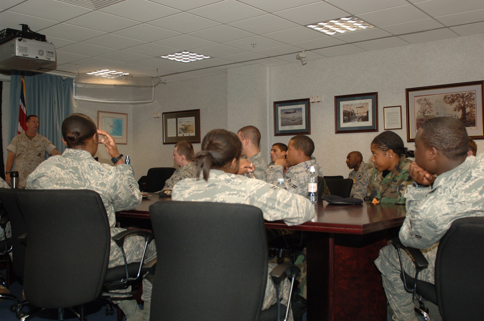 Members of the 423rd Security Forces Squadron listen as JIOCEUR Commander, Marine Corps Colonel Pete Devlin briefs the group on the mission of the JAC.  The Security Forces members were invited to the JAC as part of the JAC outreach to our partner units.  (U.S. Air Force photo by Staff Sgt. Javier Cruz)