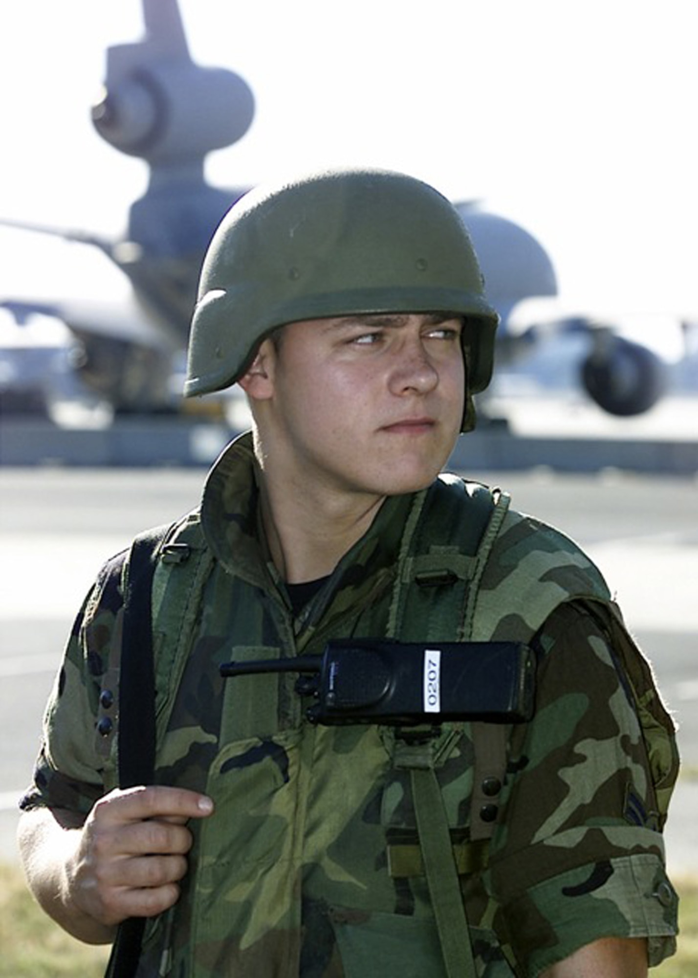Airman First Class Thomas Messick of the 514th Security Forces Squadron, McGuire Air Force Base, N.J., guards the McGuire flightline on Sept. 11, 2001, in response to the terrorist attacks at the Pentagon, the World Trade Center of New York City and in Pennsylvania. In Air Mobility Command, the response to the attacks was immediate. At McGuire, now named Joint Base McGuire-Dix-Lakehurst, search and rescue teams and medical supplies were airlifted there by AMC aircraft and crews on Sept. 12. McGuire became the designated site by FEMA to house and feed urban search and rescue teams operating in New York City.  (U.S. Air Force Photo/Ken Mann)