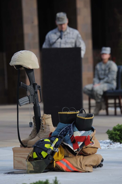 SHAW AIR FORCE BASE,S.C. -- A Shaw Airman reads a list of names of military members who lost their lives during the global war on terror at a ceremony to remember the 9/11 terrorist attacks on Sept. 11. Airmen and civilians gathered to salute the lives lost during 9/11 and sacrificed since then in the global war on terror. (U.S. Air Force photo/Senior Airman Matt Davis)