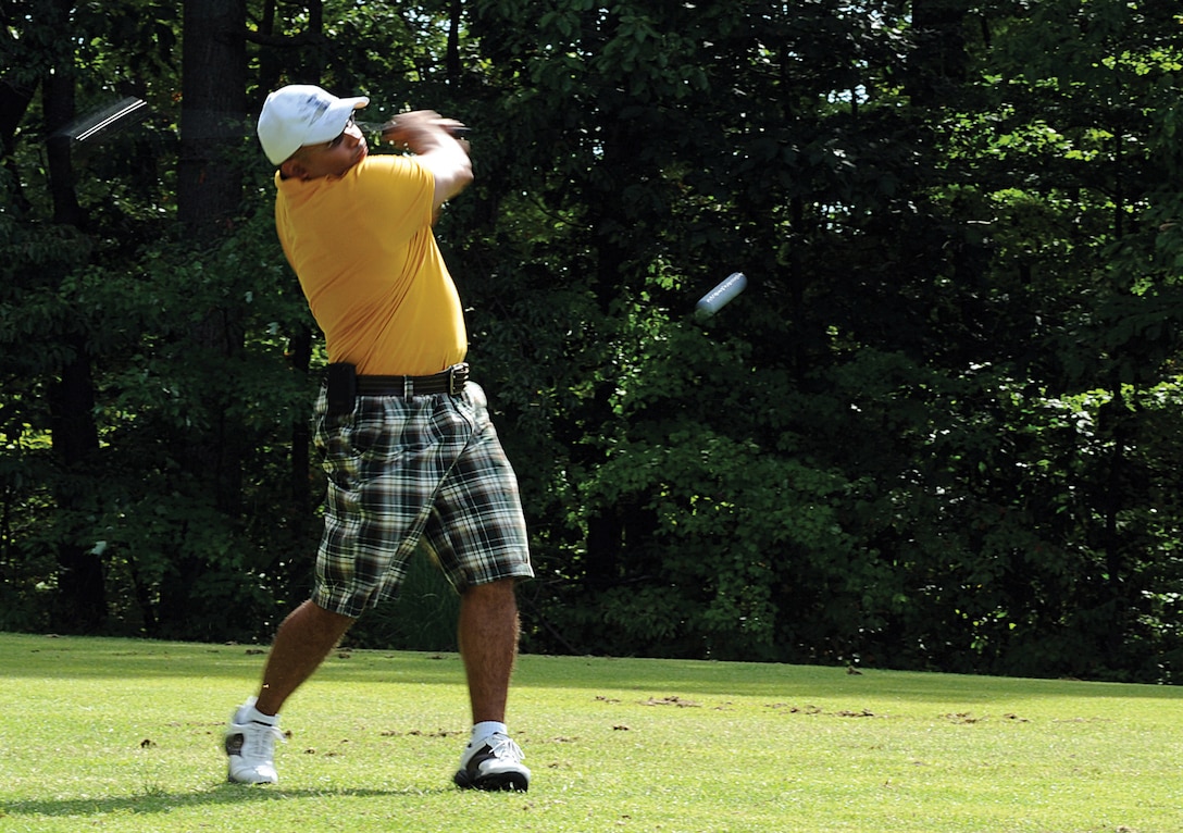 Technical Sgt. Robert Gonzalez, 316th Force Support Squadron NCO in charge of the West Fitness Center, tees off at the 3rd Annual 316th Wing Golf Tournament Sept. 3 at The Courses at Andrews. The tournament took place after the Wing Run and lunch, and was open to all 316th members. (U.S. Air Force photo/ Airman 1st Class Melissa Rodrigues)