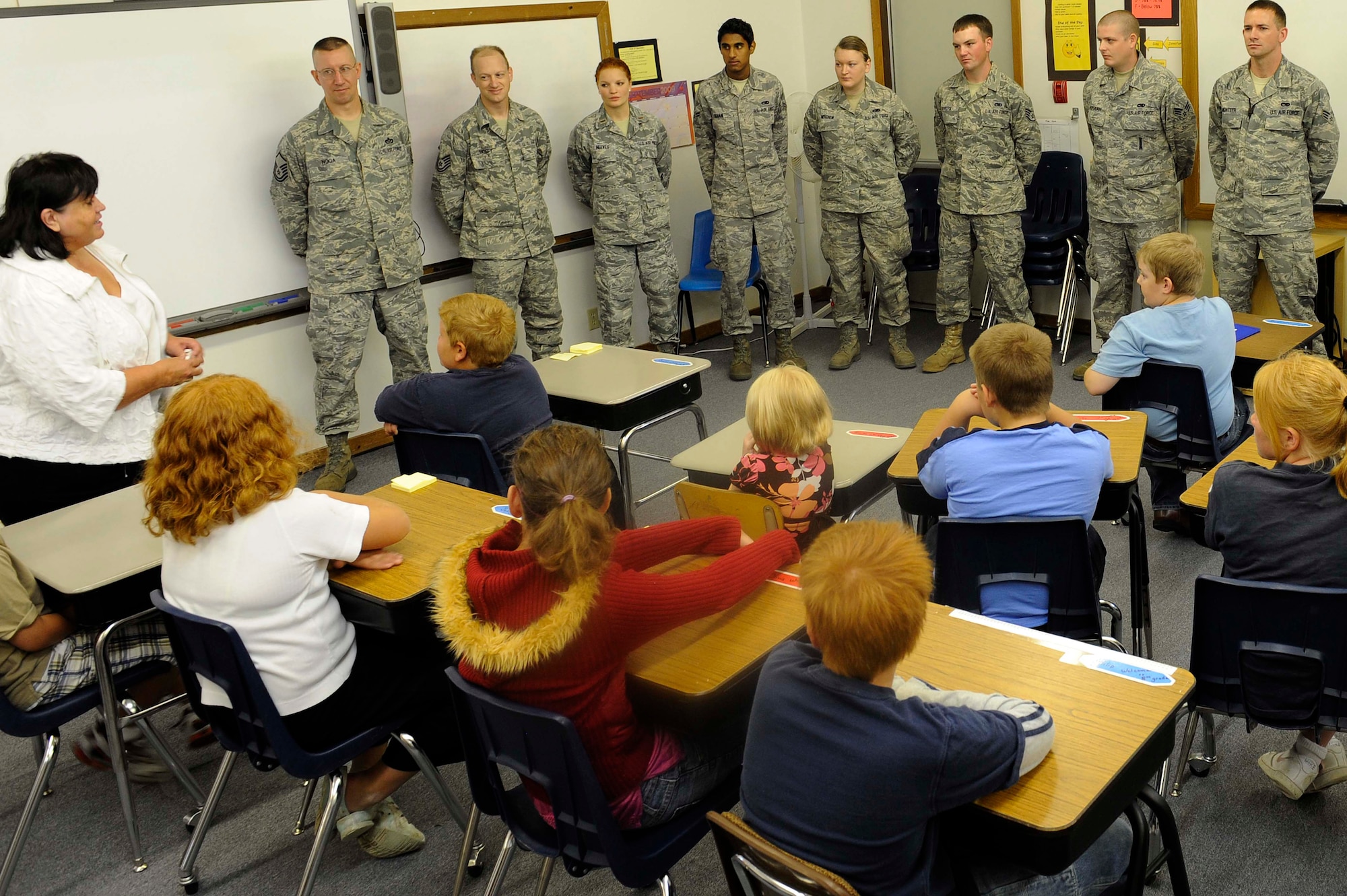 Ellsworth Airmen answer questions from students of Spring Creek School near New Underwood, S.D., Sept. 8. Ellsworth Airmen helped Jeanette Meade, Spring Creek School teacher, show students the importance of the military and privilege of education. (U.S. Air Force photo by Airman 1st Class Corey Hook)