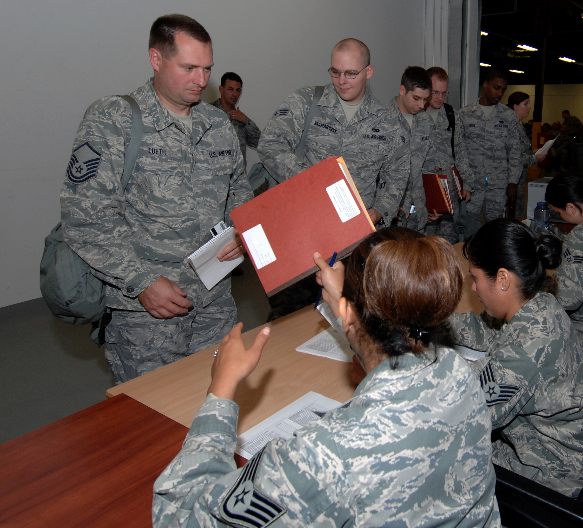 SPANGDAHLEM AIR BASE, Germany –Master Sgt. Paul Lueth, 52nd Equipment Maintenance Squadron, processes through a personnel deployment function line Sept. 8. The PDF line provides Airmen the opportunity to ask questions and verify their readiness before a deployment. (U.S. Air Force photo/Airman 1st Class Staci Miller)