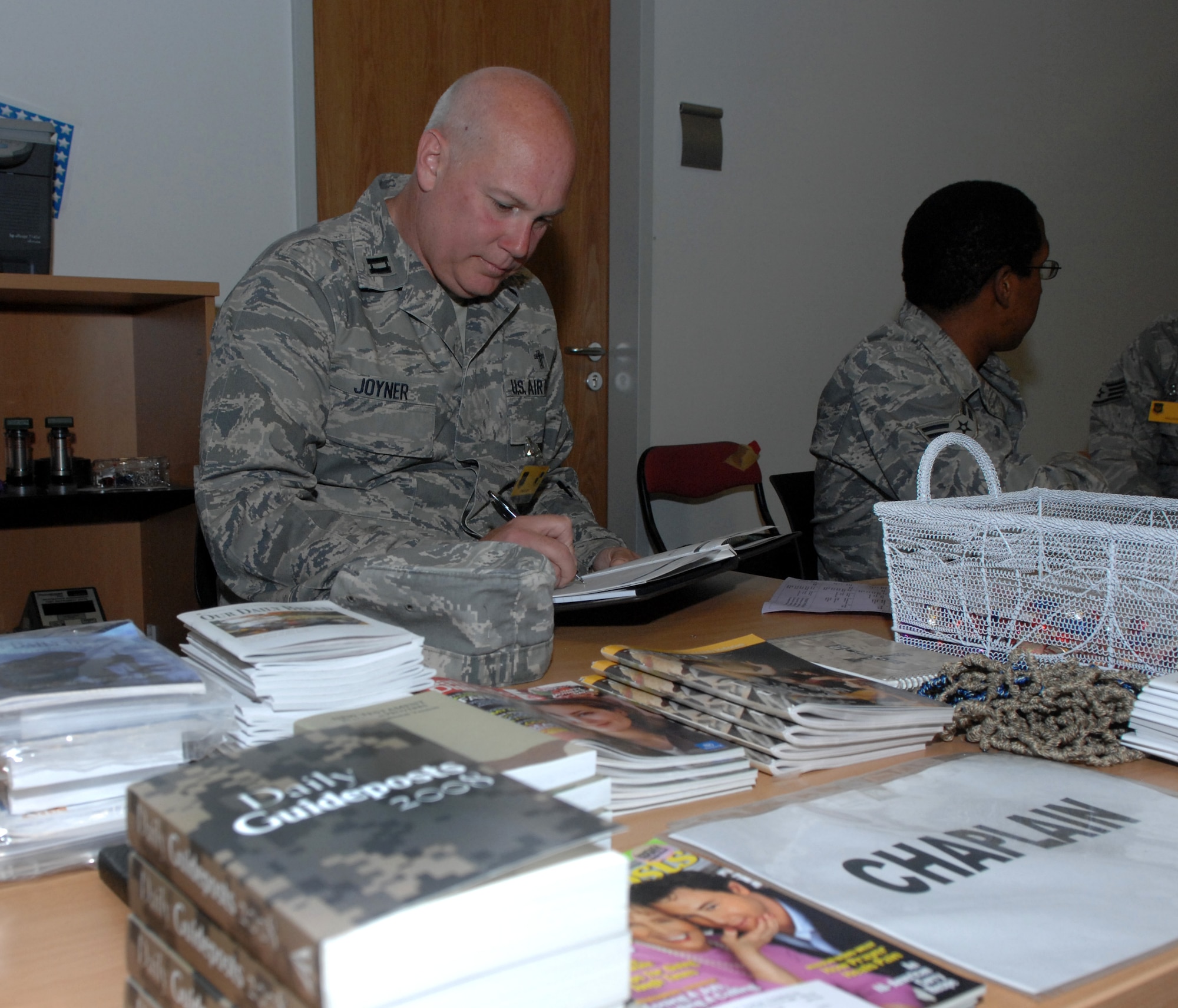 SPANGDAHLEM AIR BASE, Germany – Chaplain (Capt.) Paul Joyner, 52nd Fighter Wing Chapel, prepares to give a briefing at a personnel deployment function line Sept. 8. The PDF line provides Airmen the opportunity to ask questions and verify their readiness before a deployment. (U.S. Air Force photo/Airman 1st Class Staci Miller)