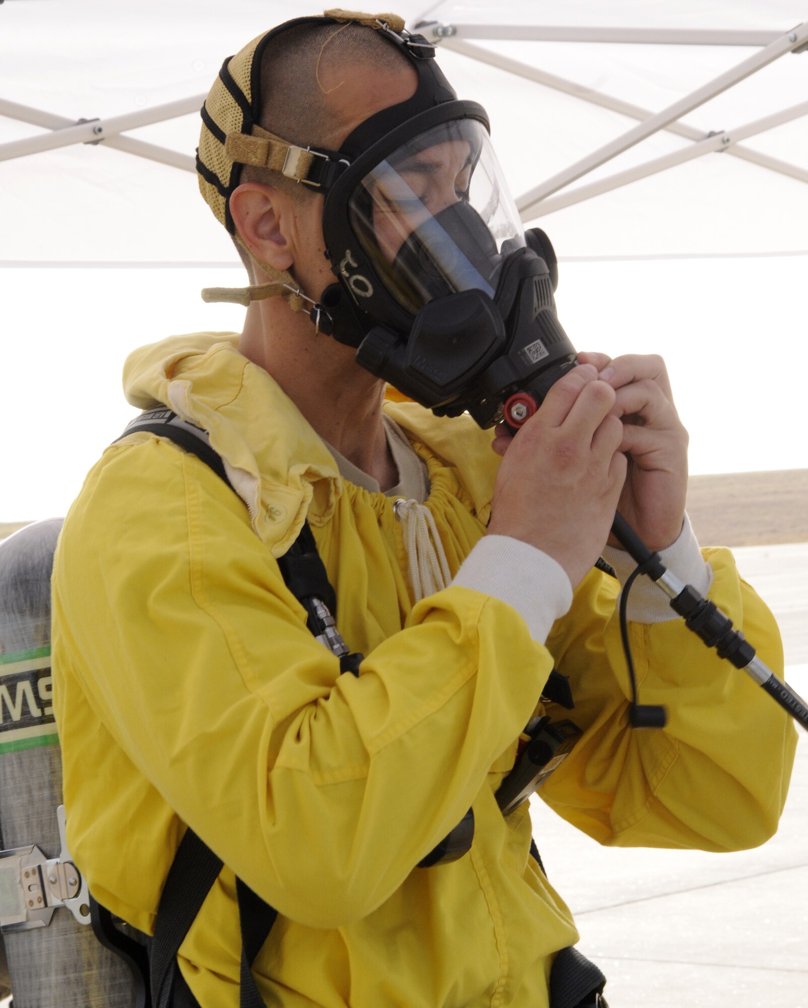 Staff Sgt. Jason Bierman, 39th Civil Engineer Squadron, explosive ordnance disposal flight, “goes on air,” or completes the seal of oxygen to his mask Sept. 10, 2009, during a base exercise at Incirlik Air Base, Turkey. An exercise evaluation team evaluated participating squadrons on their exercise responses. (U.S. Air Force photo/Airman 1st Class Amber Ashcraft)