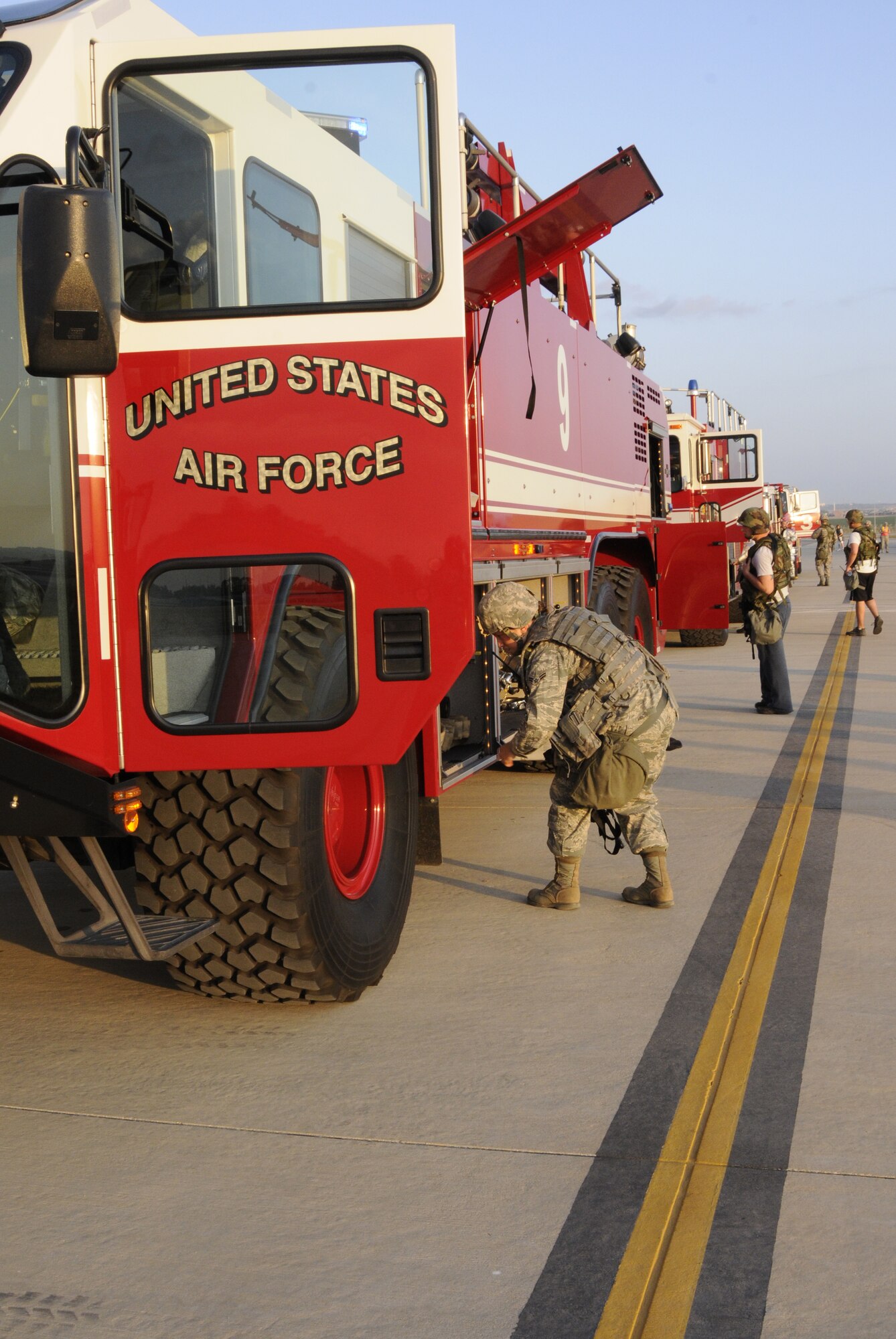 Airmen from the 39th Security Forces Squadron search fire trucks before they leave the scene Sept. 10, 2009, during a base exercise at Incirlik Air Base, Turkey. An exercise evaluation team evaluated participating squadrons on their exercise responses. (U.S. Air Force photo/Airman 1st Class Amber Ashcraft)
