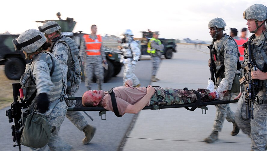 Airmen from the 39th Security Forces Squadron litter-carry a simulated victim Sept. 10, 2009, during a base exercise at Incirlik Air Base, Turkey. An exercise evaluation team evaluated participating squadrons on their exercise responses. (U.S. Air Force photo/Airman 1st Class Amber Ashcraft)