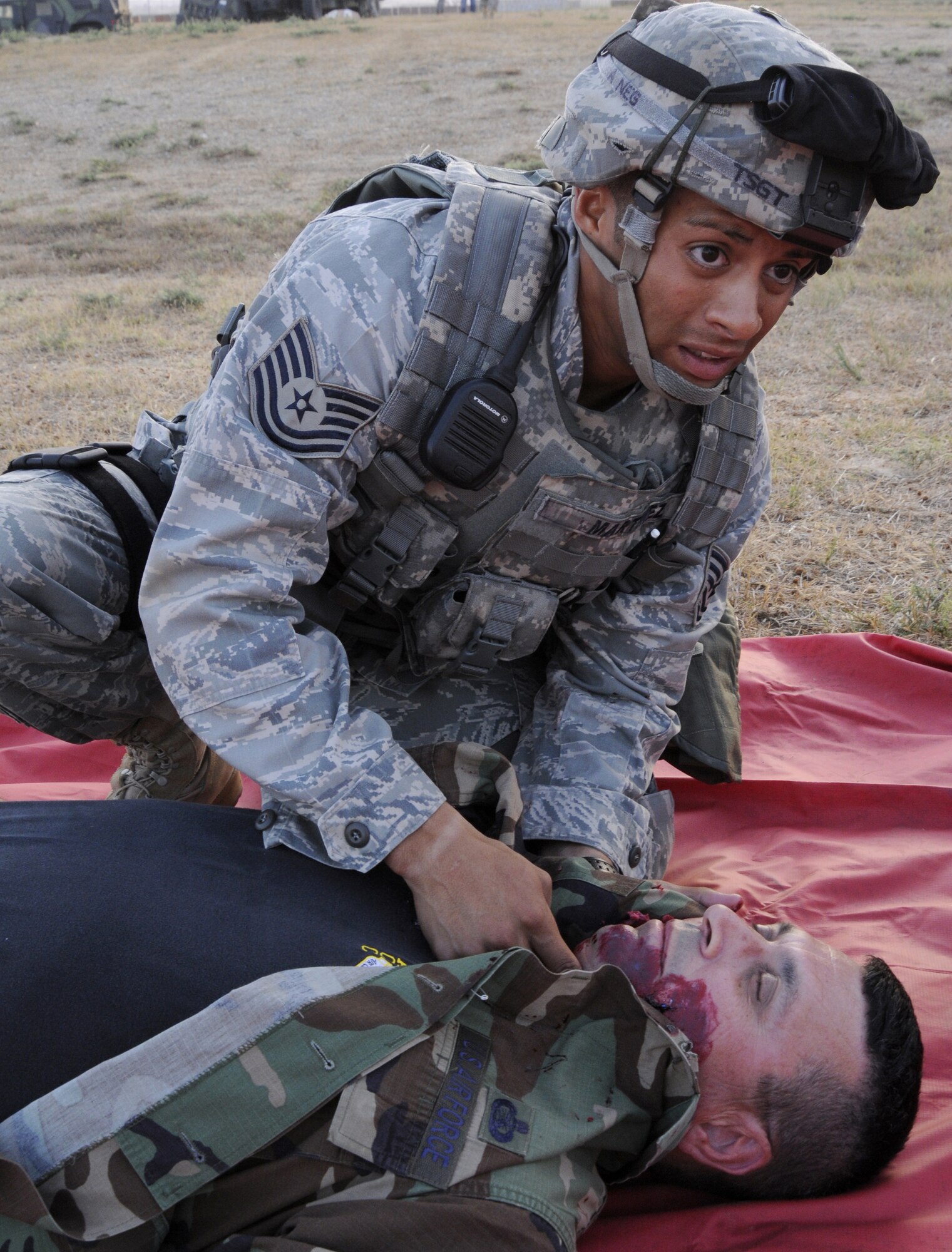 Tech Sgt. Dzajic Martinez, 39th Security Forces Squadron, attends to a simulated victim Sept. 10, 2009, during a base exercise at Incirlik Air Base, Turkey. An exercise evaluation team evaluated participating squadrons on their exercise responses. (U.S. Air Force photo/Airman 1st Class Amber Ashcraft)