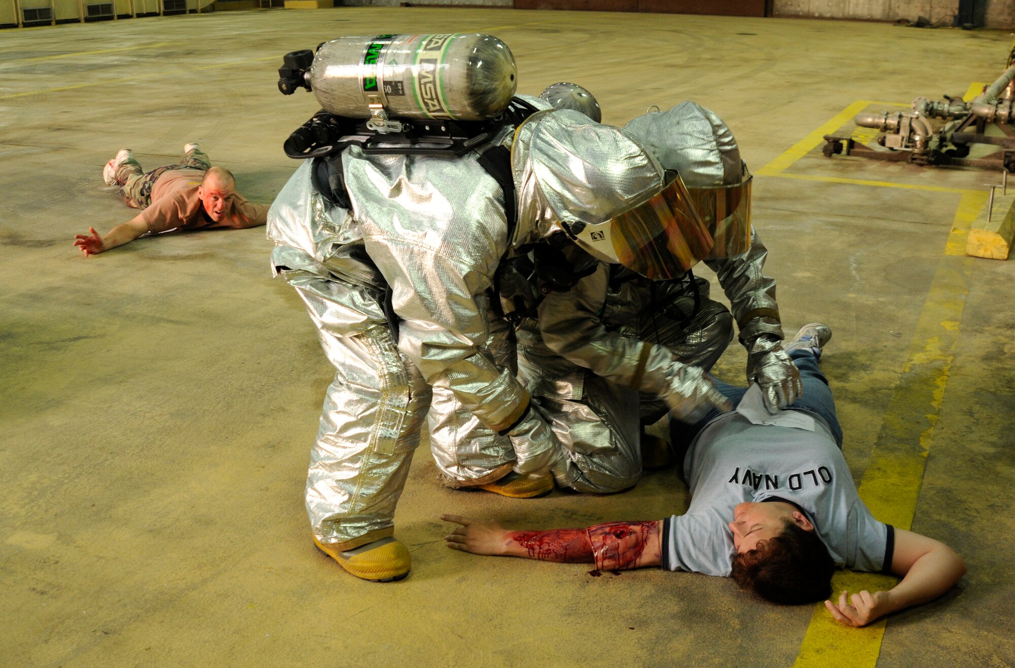Firefighters check simulated injured victims Sept. 10, 2009, during a base exercise at Incirlik Air Base, Turkey. An exercise evaluation team evaluated participating squadrons on their exercise responses. (U.S. Air Force photo/Airman 1st Class Amber Ashcraft)