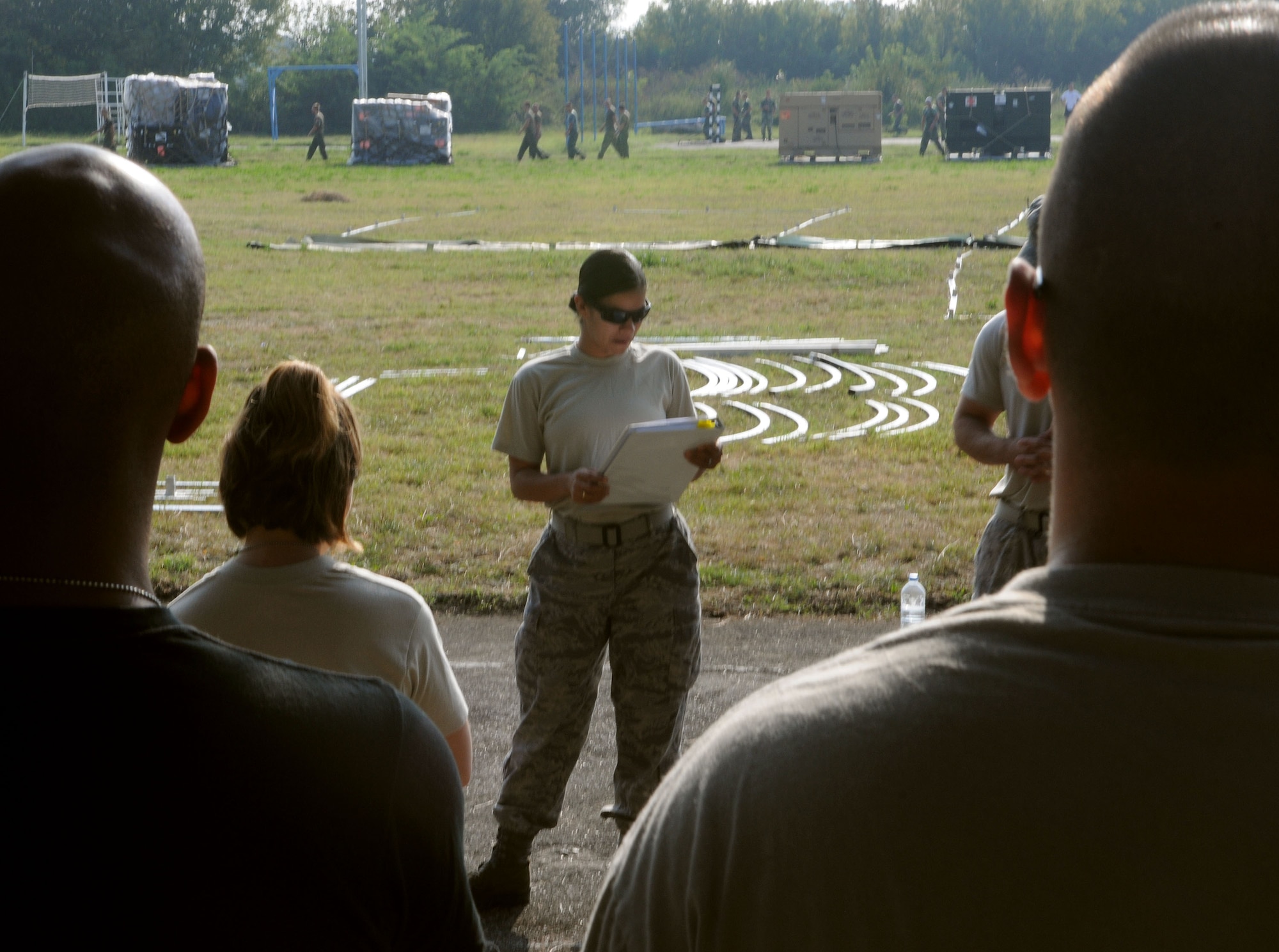 Staff Sgt. Melanie Hernandez, 458th Expeditionary Medical Squadron, briefs Airmen on the plan to set up tents for a mobile hospital Tuesday, Sept. 1, 2009, in Nis, Serbia. The 458th EMEDS stood up in support of the 2009 Military Medical Training Exercise in Central and Eastern Europe Sept. 2 – 13. The exercise, hosted by Serbia, provides a joint medical learning environment and assists host nation civilian and military services; international, private and volunteer organizations; and other participating nations in enhancing disaster response actions. Fifteen nations participated in the exercise. (U.S. Air Force Photo/Senior Airman Alex Martinez)
