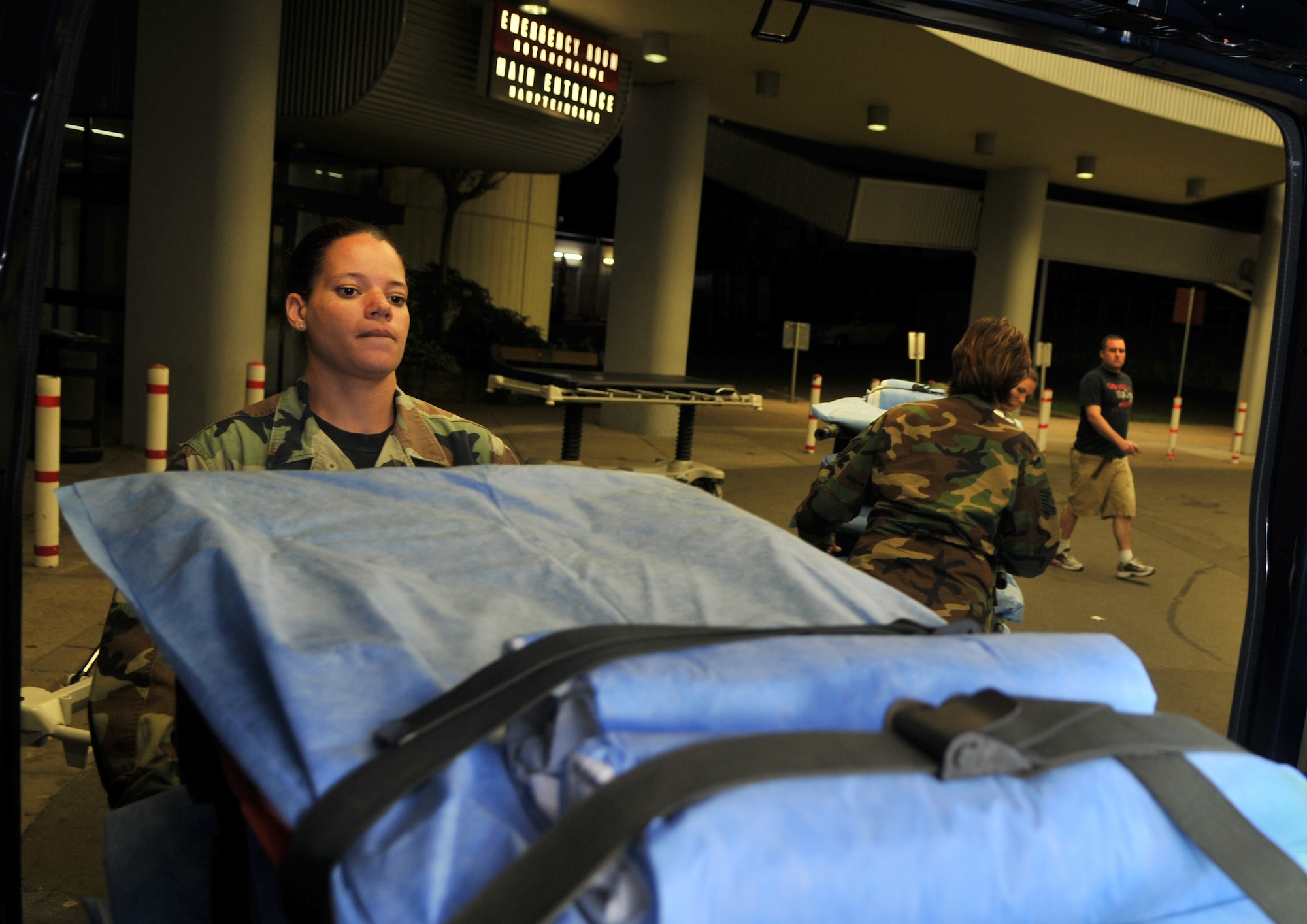 U.S. Air Force Tech. Sgt. Laura Small, 86th Contingency Aeromedical Staging Facility medical technician, unloads gurneys at Landstuhl Regional Medical Center, Aug. 27, 2009. The gurneys will be used to transport wound warriors to an aircraft taking them to Walter Reed Army Medical Center for further medical treatment. (U.S. Air Force photo by Senior Airman Nathan Lipscomb)